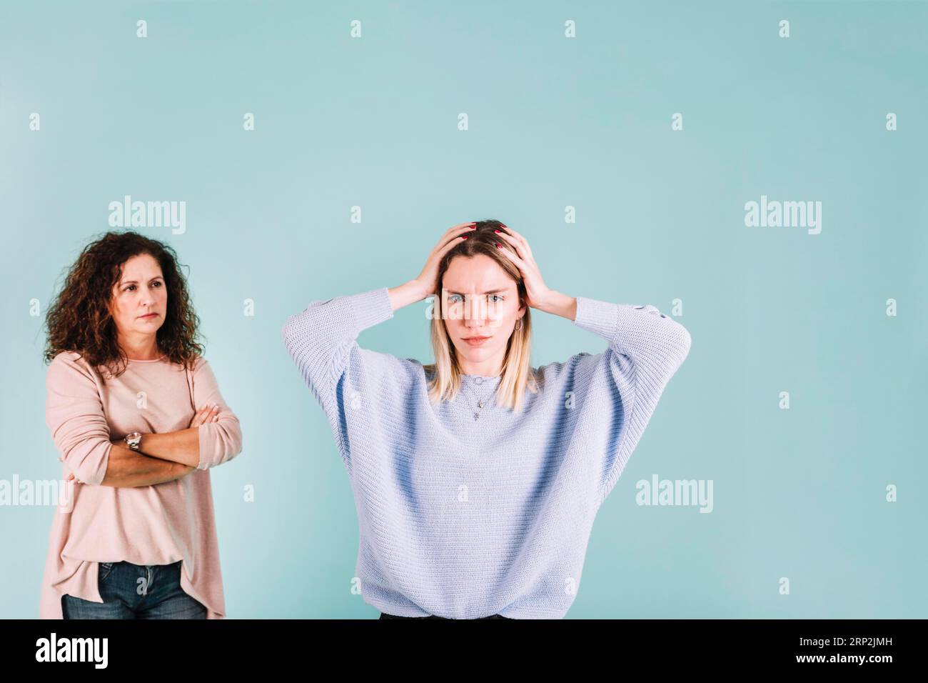 https://c8.alamy.com/comp/2RP2JMH/displeased-woman-arguing-with-mom-2RP2JMH.jpg