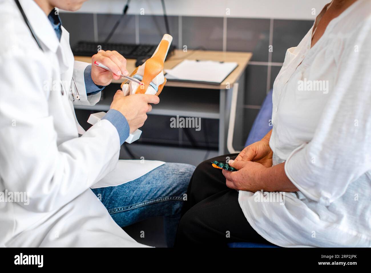 Doctor hands showing bone joints patient Stock Photo Alamy