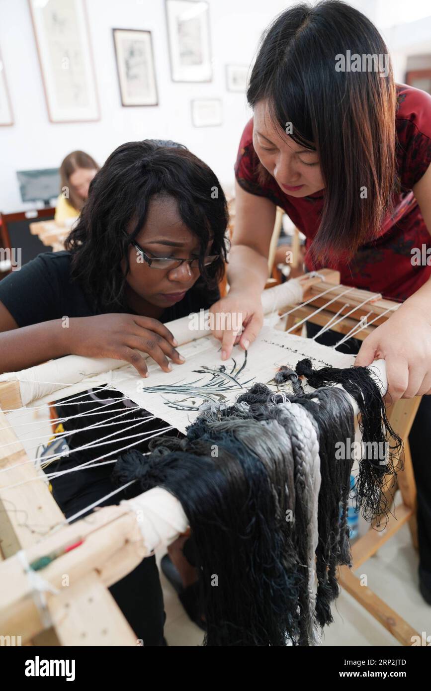 (180905) -- XINYU, Sept. 5, 2018 -- An African student learns embroidery under the coach of teacher Fu Aixiaing at Xinyu University in Xinyu, east China s Jiangxi Province, Sept. 5, 2018. The Xinyu university set up courses of embroidery and martial arts for African students to learn about Chinese culture as the new semester begins. ) CHINA-JIANGXI-AFRICAN STUDENT-CHINESE CULTURE (CN) SongxZhenping PUBLICATIONxNOTxINxCHN Stock Photo