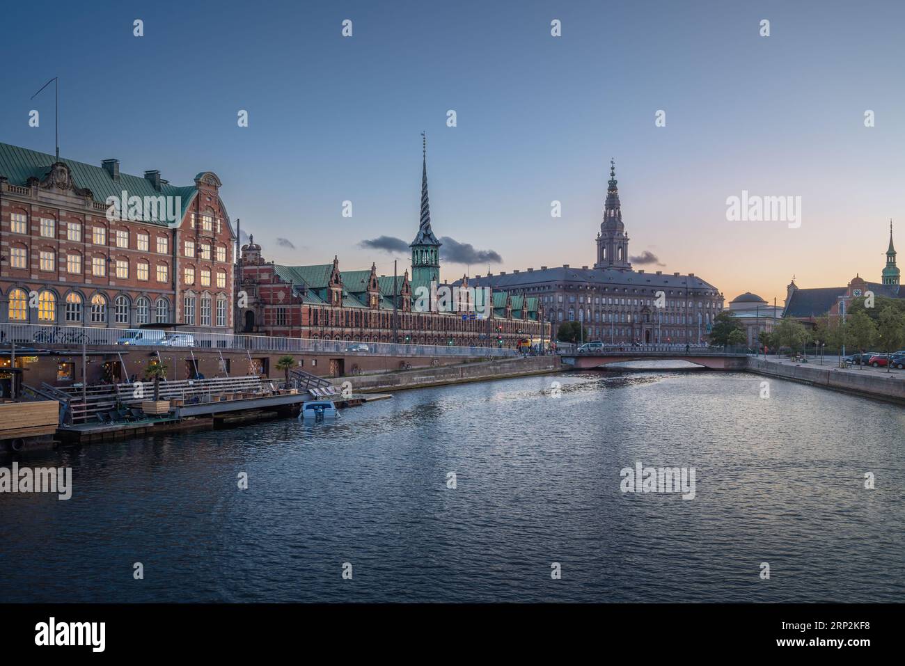 Copenhagen Canal Skyline and Slotsholmen with Borsen and Christianborg at sunset - Copenhagen, Denmark Stock Photo