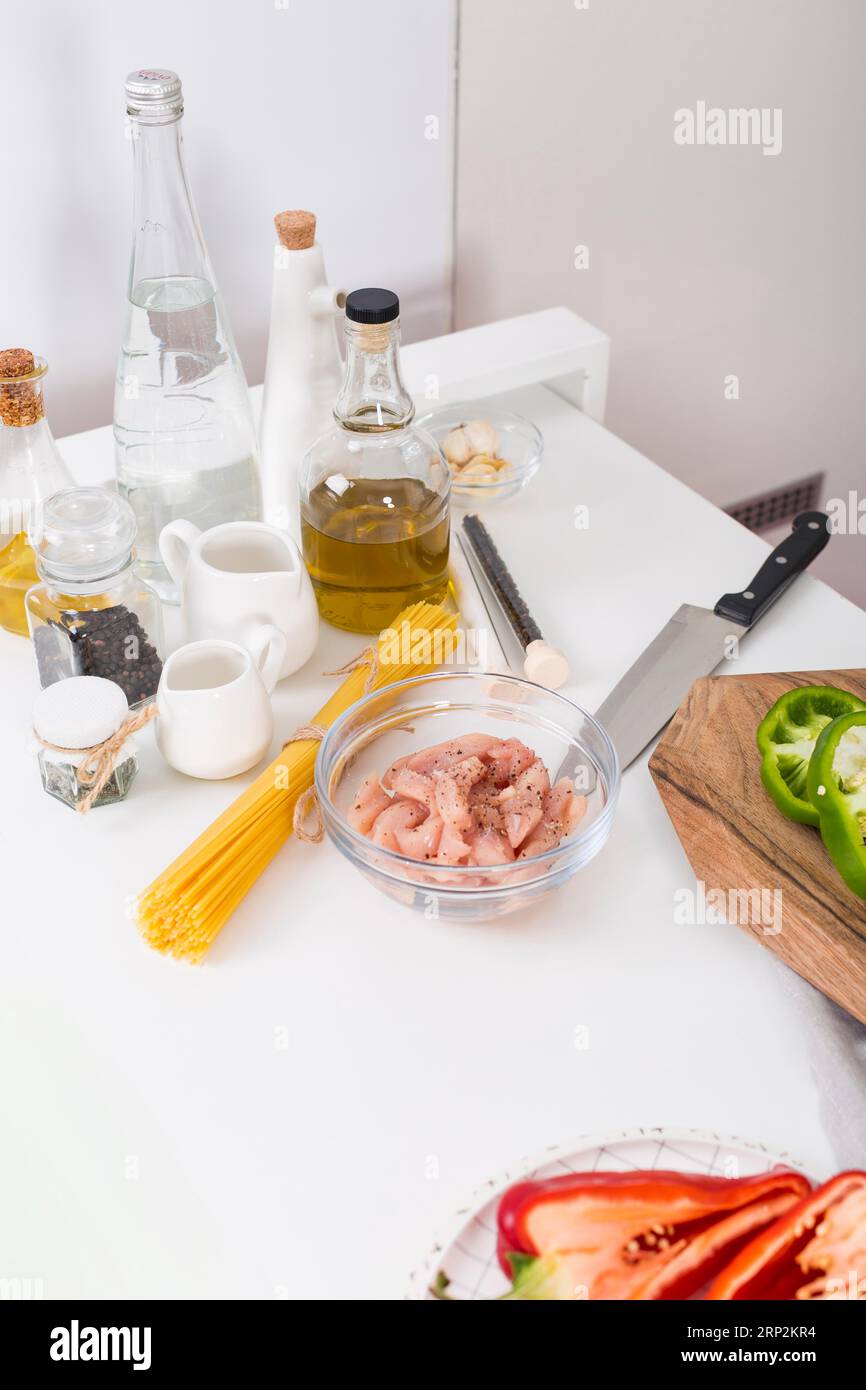 Ingredients making spaghetti white table Stock Photo