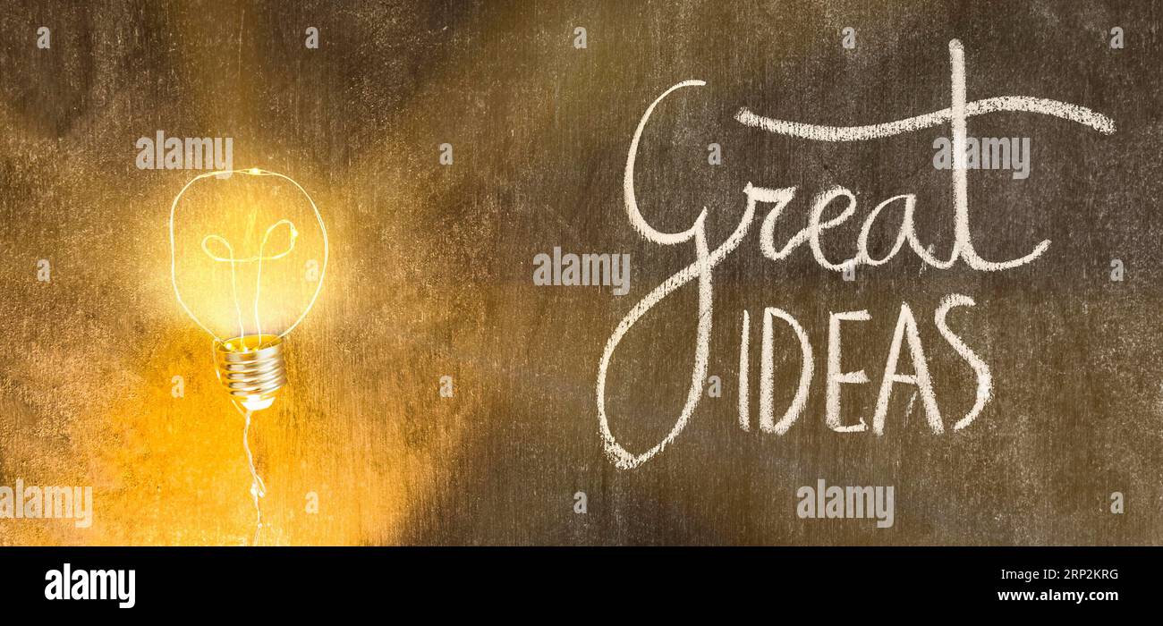 Illuminated light bulb with great ideas text written chalkboard Stock Photo