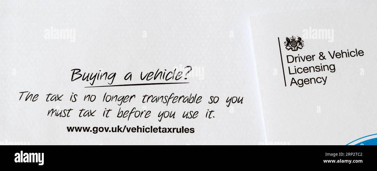 Message on correspondence from DVLA reminds that tax is no longer transferable and a secondhand car must be re-taxed. Stock Photo