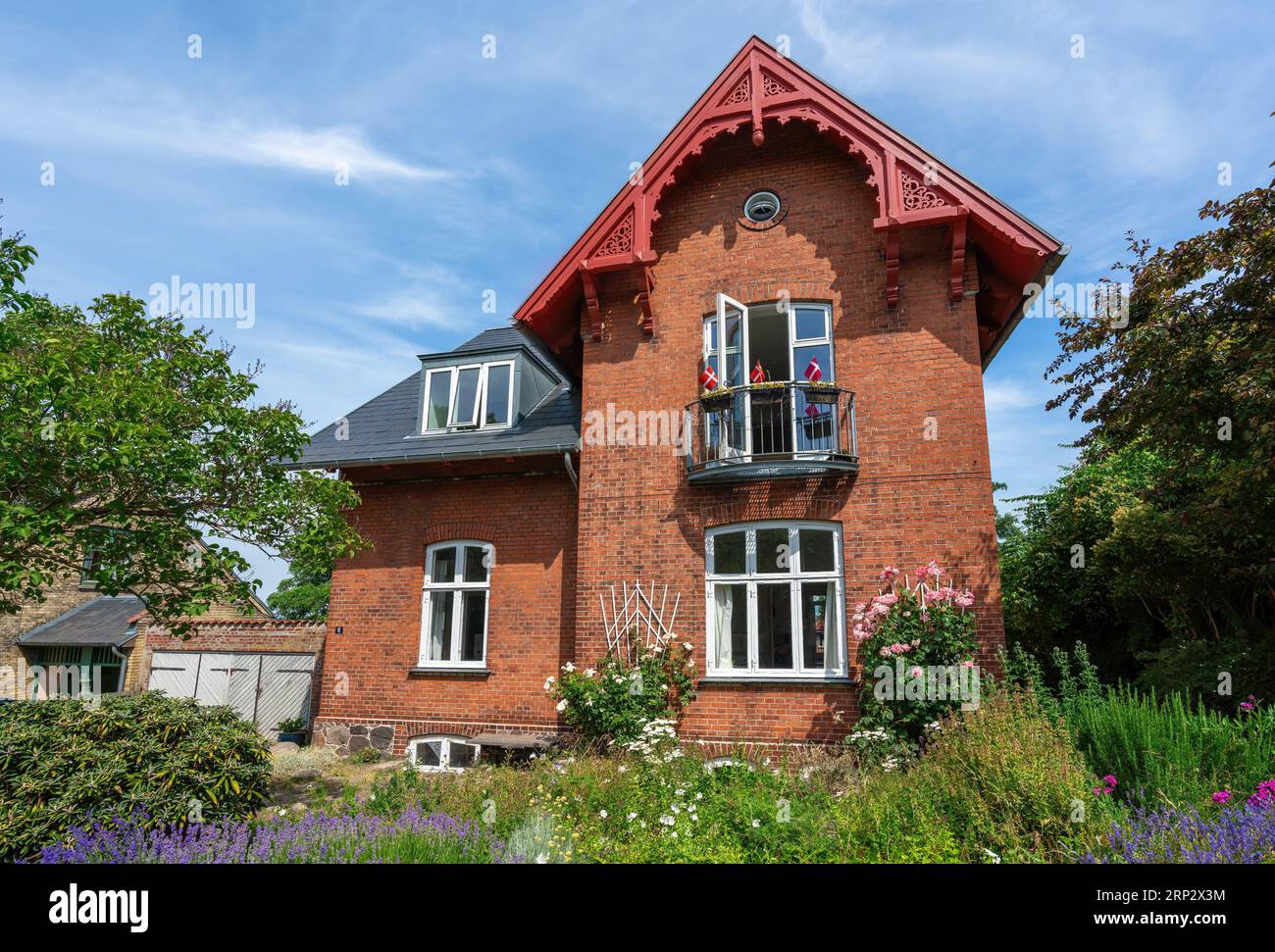 Traditional house with Danish Flags - Roskilde, Denmark Stock Photo