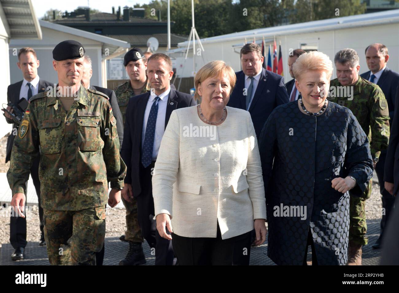 (180914) -- RUKLA (LITHUANIA), Sept. 14, 2018 -- Lithuanian President Dalia Grybauskaite (R, Front) and German Chancellor Angela Merkel (C, Front) visit the NATO multinational battalion in Rukla, Lithuania, on Sept. 14, 2018. The German chancellor paid a visit to Lithuania on Friday. ) LITHUANIA-RUKLA-GERMANY-MERKEL-VISIT AlfredasxPliadis PUBLICATIONxNOTxINxCHN Stock Photo