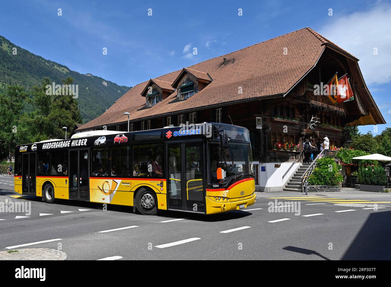 Road Traffic Postbus, Interlaken, Switzerland Stock Photo