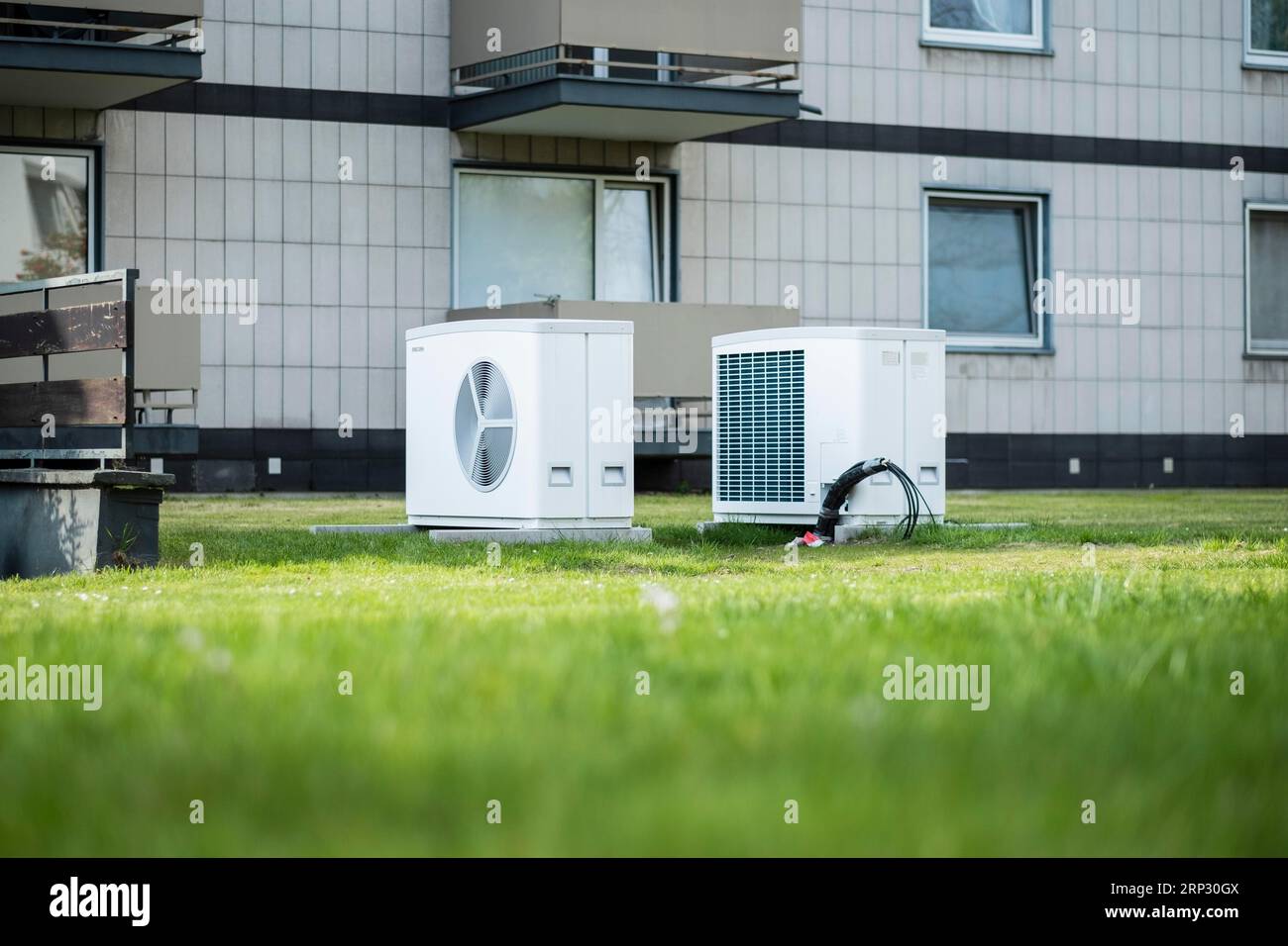 Two heat pumps on a lawn of an apartment building in Duesseldorf, North