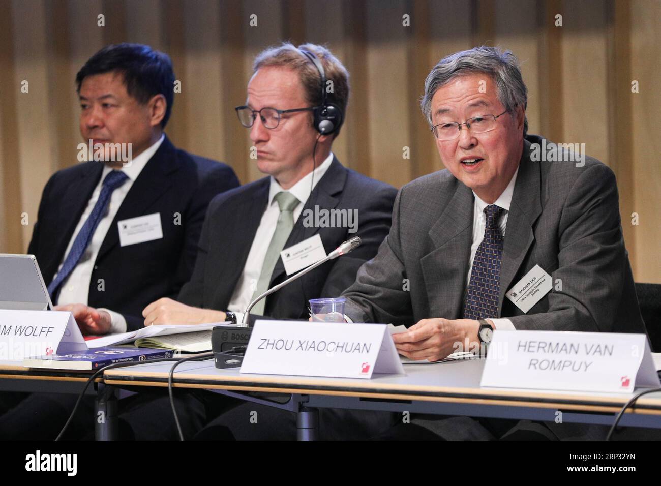 (180918) -- BRUSSELS, Sept. 18, 2018 -- Zhou Xiaochuan (R), president of the China Society for Finance and Banking, who also serves as an adviser of China Center for International Economic Exchanges, addresses the seminar Perils and potential: China-US-EU trade relations held in Brussels, Belgium, on Sept. 17, 2018. Amid increasing tensions of trade wars worldwide, around 100 leading scholars from China and Europe gathered here in the headquarters of Belgian think tank Bruegel Monday, calling on China and Europe to reduce misunderstanding via open and fair discussions on all levels. ) (hy) BEL Stock Photo