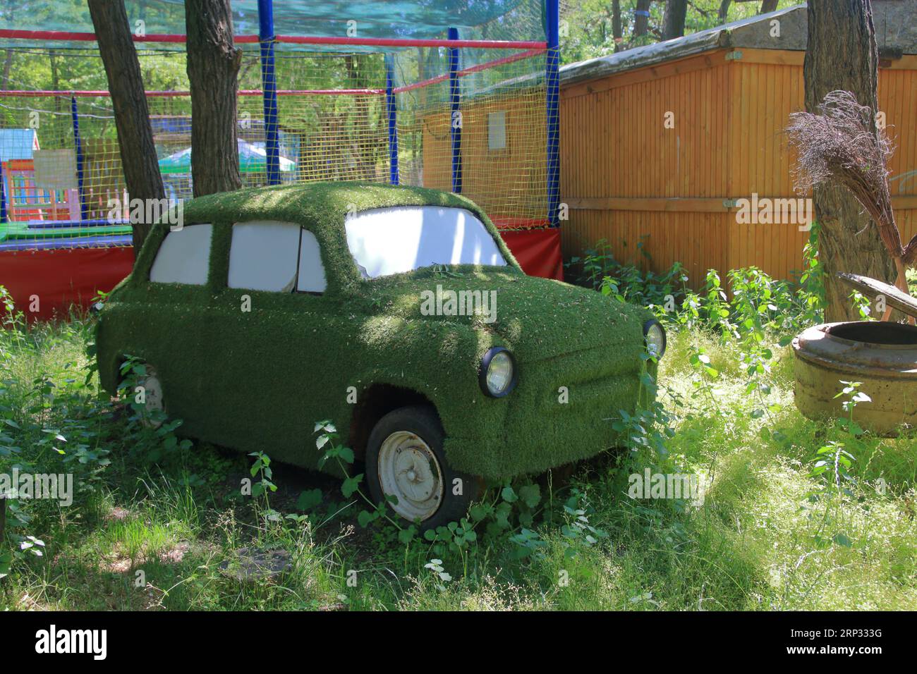 The photo was taken in the public practice of the city of Odessa. The picture shows an old abandoned car with a funny tuning. Stock Photo