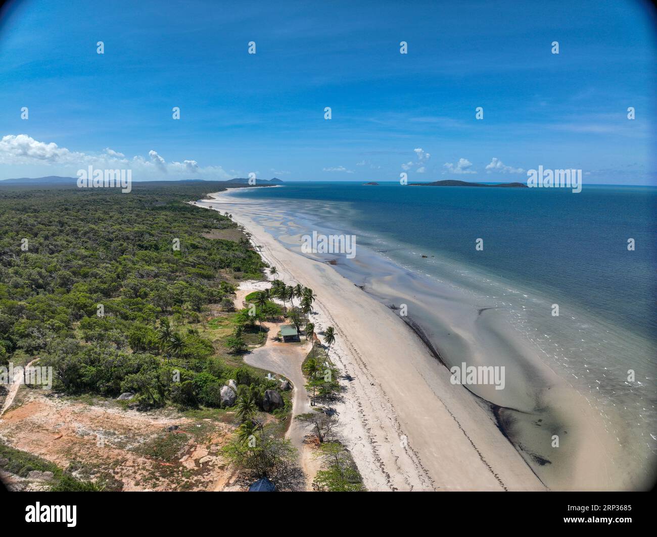 Aerial view of white rippling sandy beach and blue clear water in Lockhart River Stock Photo