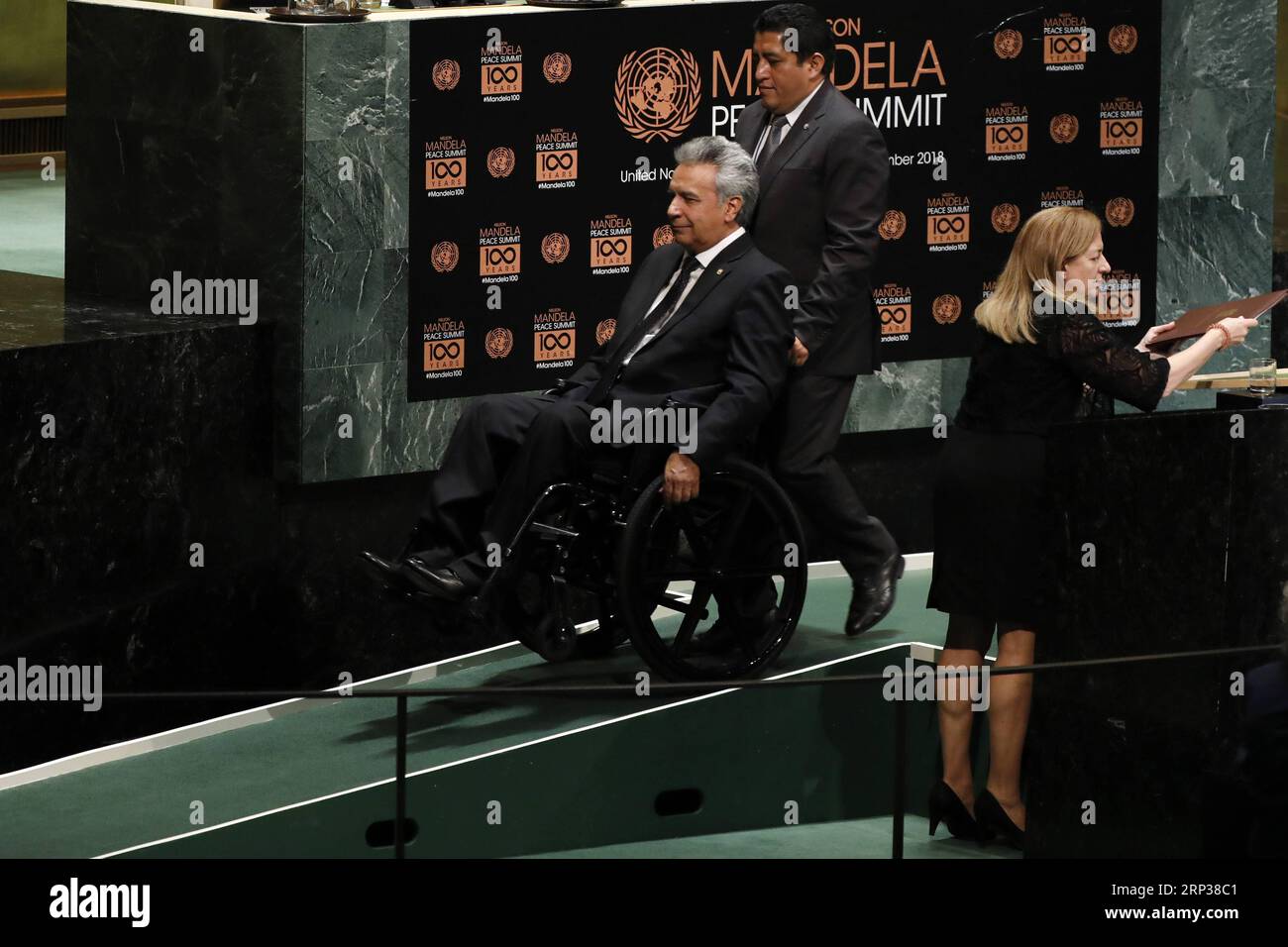 (180924) -- UNITED NATIONS, Sept. 24, 2018 -- Ecuadorian President Lenin Moreno (1st L) leaves after addressing the Nelson Mandela Peace Summit held during the ongoing UN General Assembly s annual top-level meeting at the UN headquarters in New York, on Sept. 24, 2018. UN Secretary-General Antonio Guterres said Monday that Nelson Mandela embodied the highest values of the world body, in remembrance of the late South African leader who was a hallmark in the fight against apartheid. ) UN-GENERAL ASSEMBLY-NELSON MANDELA PEACE SUMMIT LixMuzi PUBLICATIONxNOTxINxCHN Stock Photo