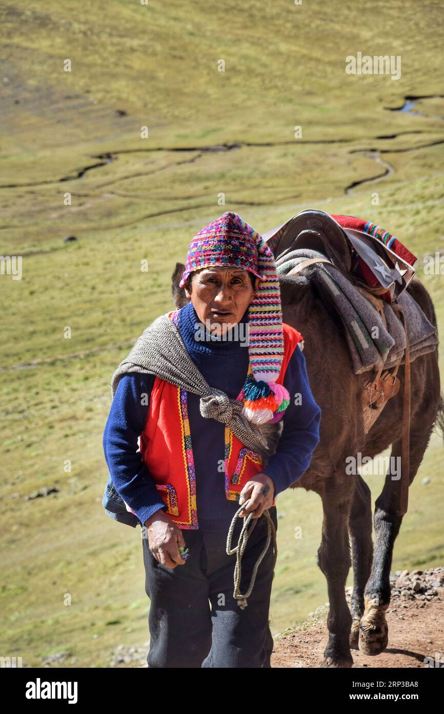 Traditional man at the Vinicunca mountains near Cuzco Stock Photo