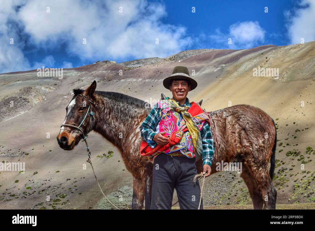 Traditional man at the Vinicunca mountains near Cuzco Stock Photo