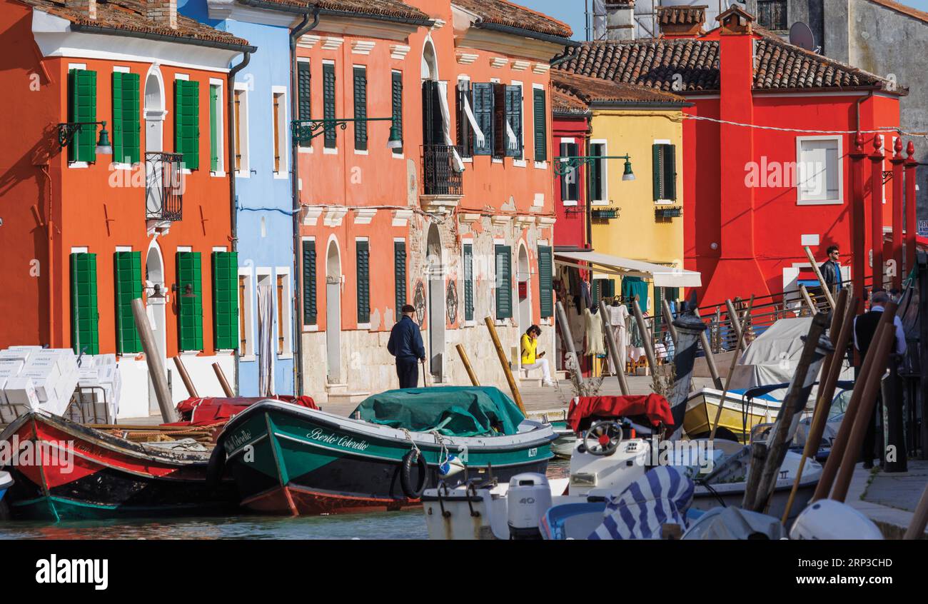 Burano island in the Venetian Lagoon, Municipality of Venice, Italy.  Colourful houses and canal. Stock Photo
