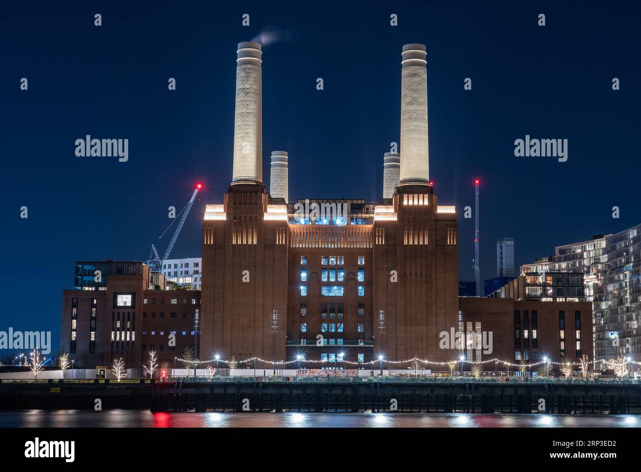 This is a riverside night view of the Battersea Power Station, an iconic landmark building on March 22, 2022 in London, United Kingdom Stock Photo