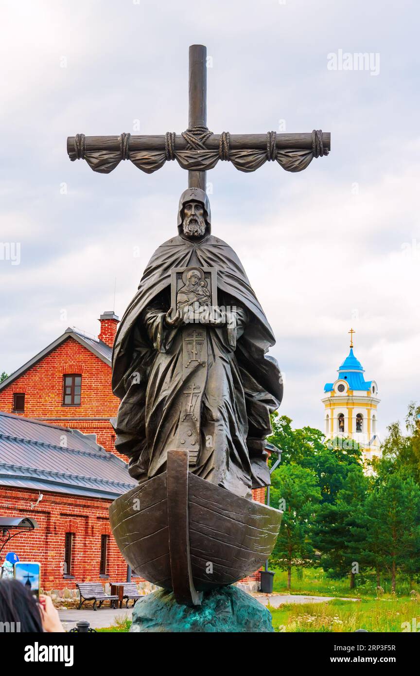 Konevets, Russia, 22 July 2023. Monument to the Monk Arseny of Konevets on Konevets Island overlooking the Monastery of the Nativity of the Theotokos. Stock Photo