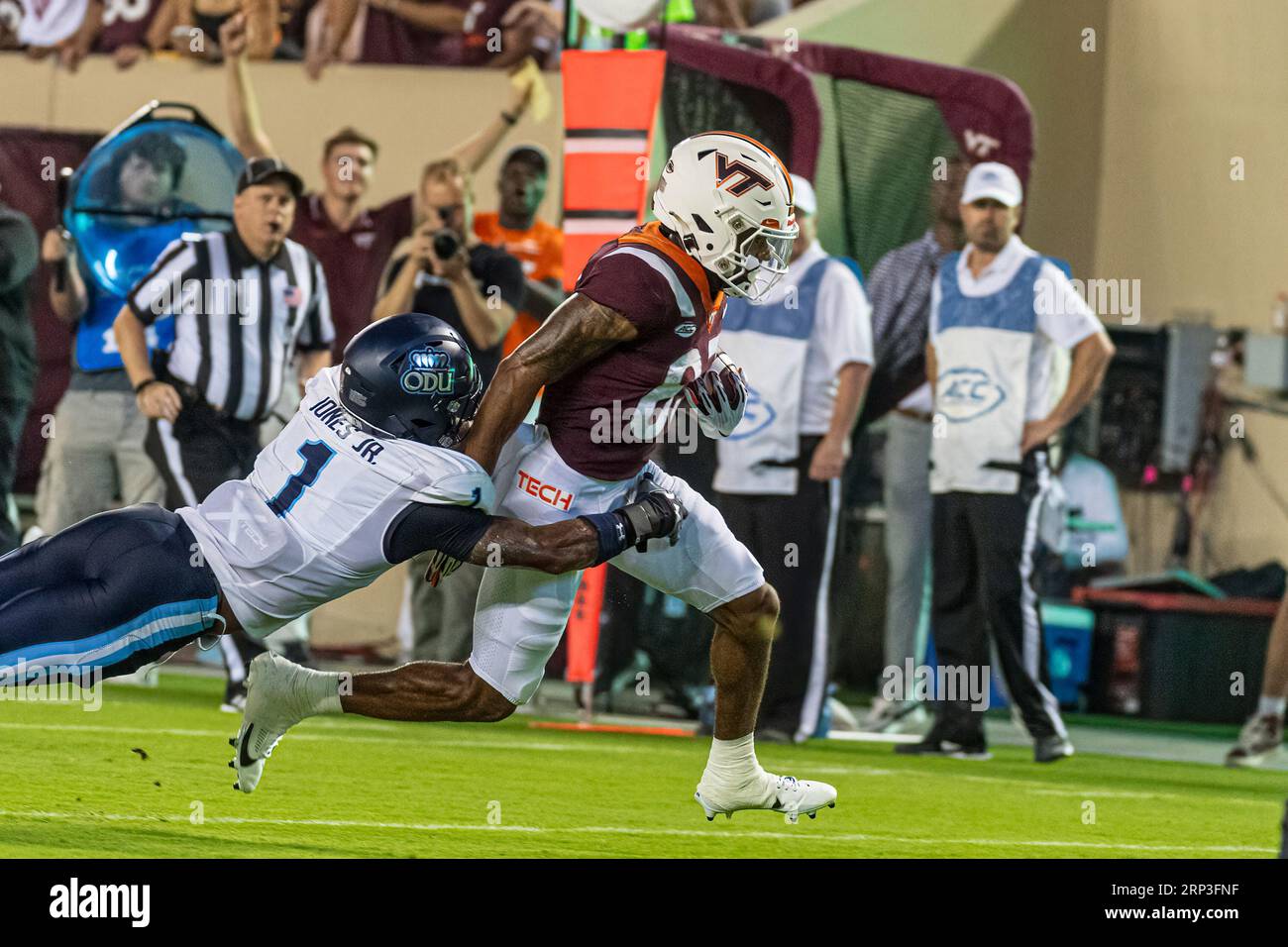 Virginia Tech's Jaylin Lane (83) goes by Terry Jones (1) for a