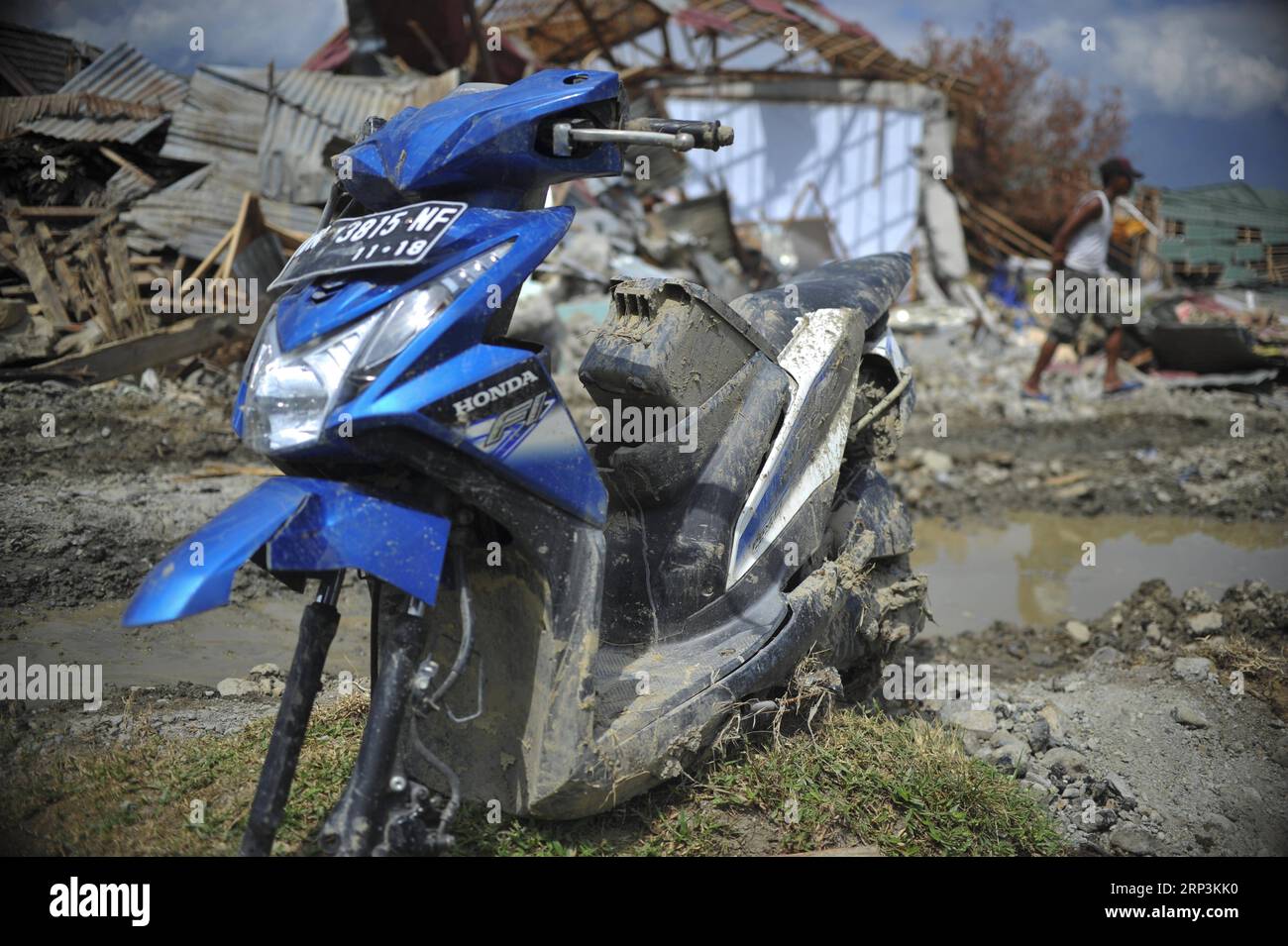 (181010) -- POSO, Oct. 10, 2018 -- A broken motorbike is seen in Poso, Central Sulawesi Province, Indonesia, on Oct. 9, 2018. The earthquakes and the tsunami have killed at least 2,010 people, left over 5,000 others missing and triggered massive damage and a huge evacuation, according to the national disaster management agency. ) (yy) INDONESIA-POSO-EARTHQUAKE AND TSUNAMI-AFTERMATH Zulkarnain PUBLICATIONxNOTxINxCHN Stock Photo