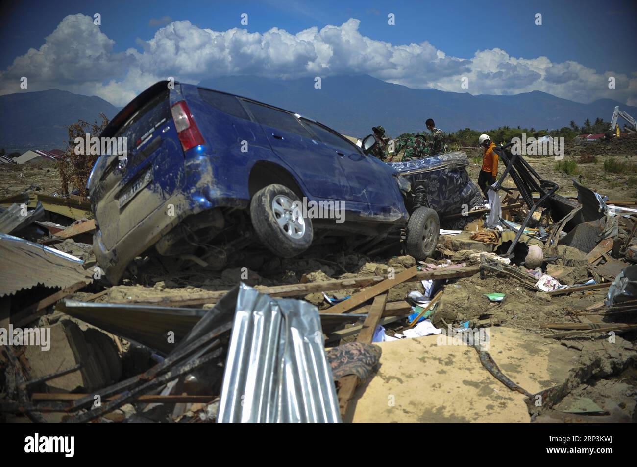 (181010) -- POSO, Oct. 10, 2018 -- An Indonesian search and rescue team check the debris at Petobo in Poso, Central Sulawesi Province, Indonesia, on Oct. 10, 2018. The earthquakes and the tsunami have killed at least 2,010 people, left over 5,000 others missing and triggered massive damage and a huge evacuation, according to the national disaster management agency. ) (dtf) INDONESIA-POSO-EARTHQUAKE AND TSUNAMI-AFTERMATH Zulkarnain PUBLICATIONxNOTxINxCHN Stock Photo