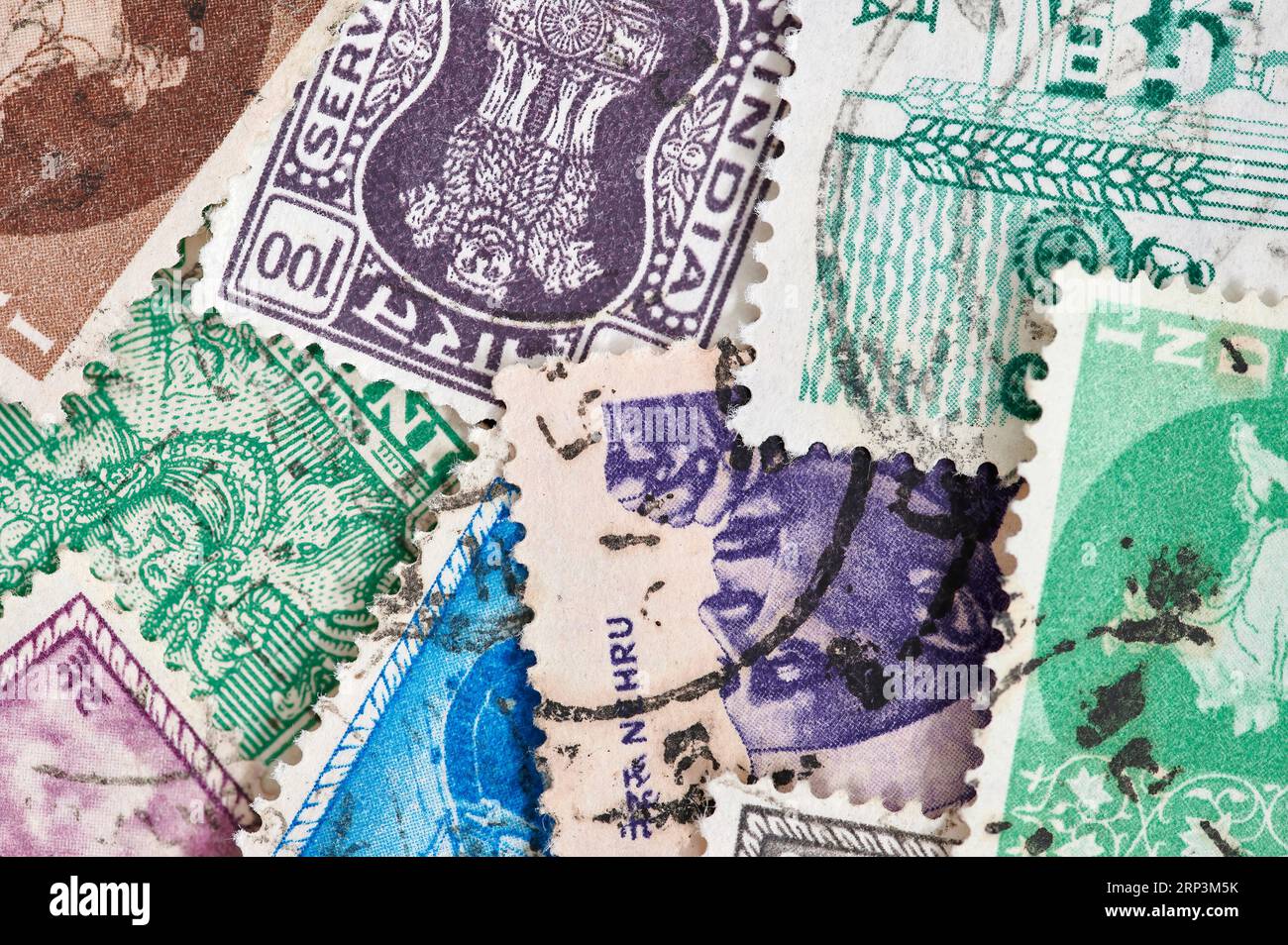 Madrid, Spain; 08-13-2023: Group of postage stamps from the Hindu country of India with motifs about their religion and culture forming a background Stock Photo