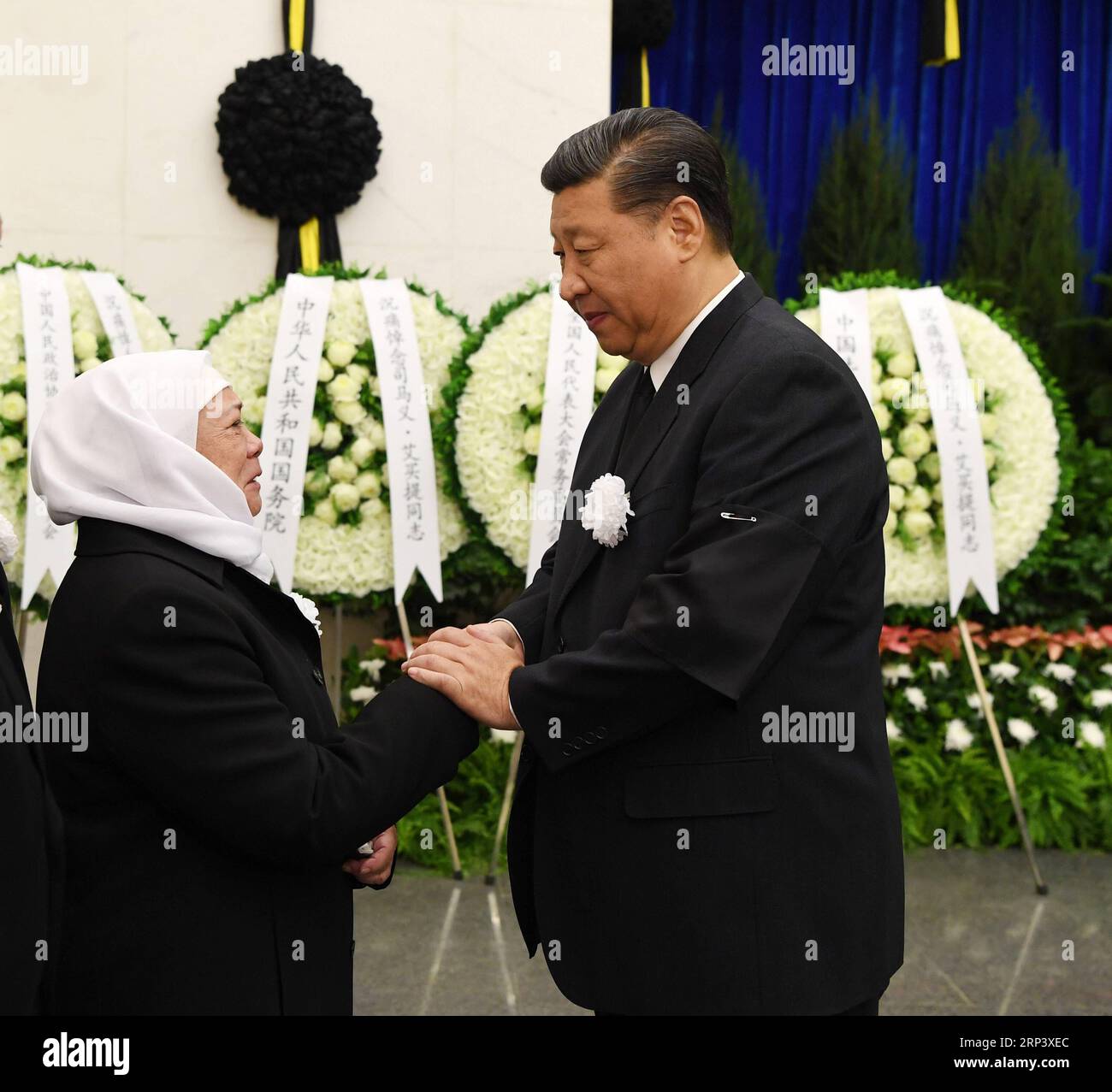 (181018) -- BEIJING, Oct. 18, 2018 -- Chinese President Xi Jinping (R) extends condolence to the family of the late Ismail Amat, vice chairperson of the Standing Committee of the 10th National People s Congress, at the Babaoshan Revolutionary Cemetery in Beijing, capital of China, Oct. 18, 2018. The funeral of Ismail Amat was held Thursday in Beijing. Ismail Amat, also vice chairperson of the 7th National Committee of the Chinese People s Political Consultative Conference and former state councilor, passed away due to illness at the age of 84 in Beijing on Oct. 16. Xi Jinping, Li Zhanshu, Wang Stock Photo