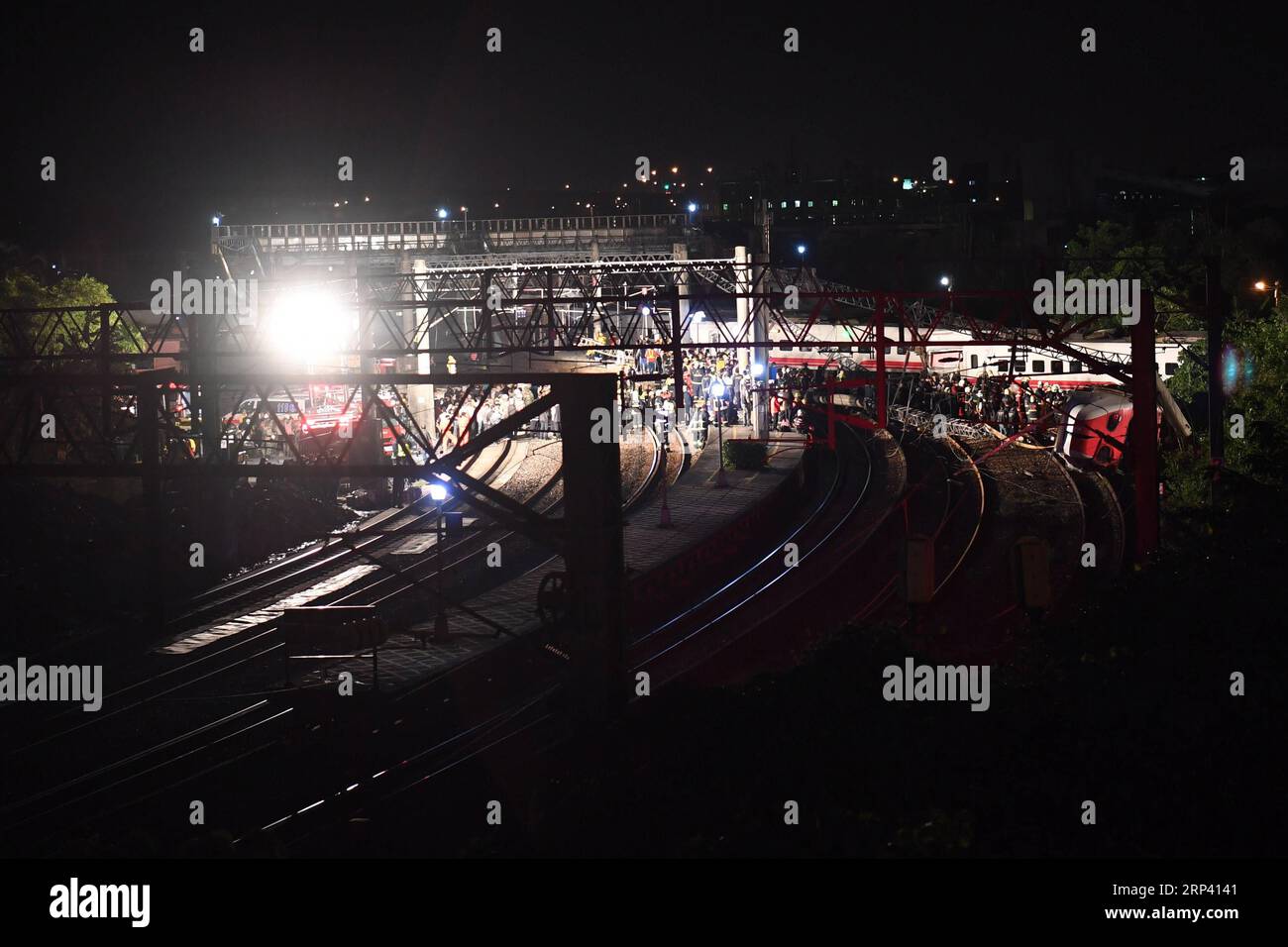(181021) -- YILAN, Oct. 21, 2018 -- Photo taken on Oct. 21, 2018 shows the train derailment site in Yilan County, southeast China s Taiwan. At least 17 people died and another 120 injured as of 7 p.m. Sunday local time, after a passenger train derailed in Taiwan on Sunday afternoon, according to the island s railway authority. The Puyuma Express No. 6432 bound for Taitung from Shulin Station with 366 passengers on board derailed at 4:50 p.m. local time at Su aoxin Station in Yilan County. A total of 17 people were declared dead before being sent to hospital. Five of the eight cars of the expre Stock Photo