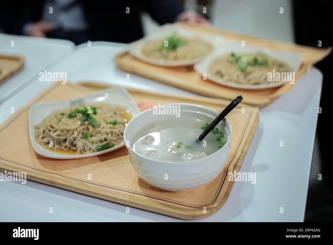 181023) -- NEW YORK, Oct. 23, 2018 -- Shaxian Wonton and noddles with  peanut sauce, which are signature dishes of Shaxian Snacks, are seen in the  Shaxian Snacks restaurant in Brooklyn, New