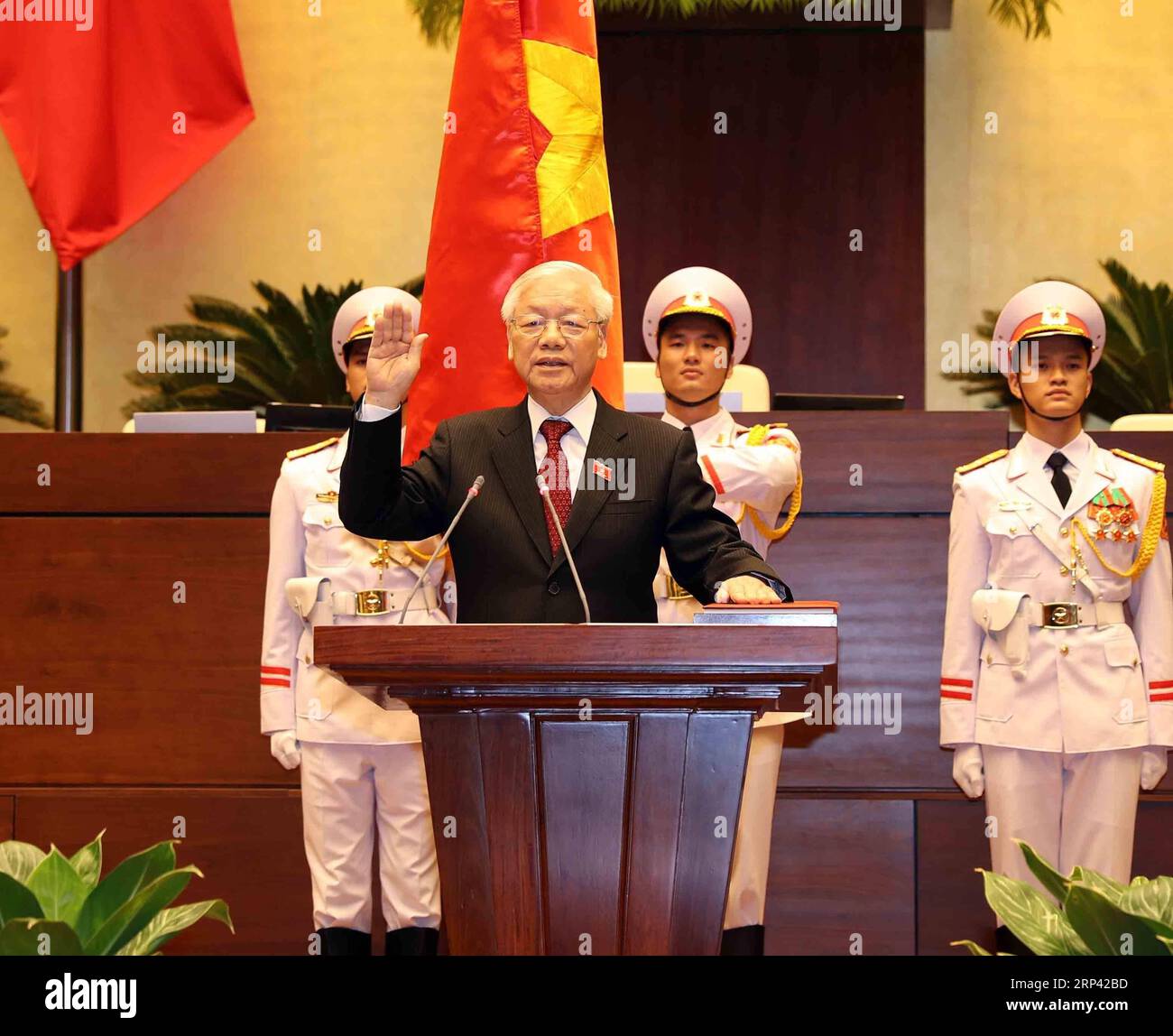 (181023) -- HANOI, Oct. 23, 2018 -- Vietnam s newly elected President Nguyen Phu Trong (C, front) takes the oath of allegiance to the Constitution at the Parliament House in Hanoi, capital of Vietnam, on Oct. 23, 2018. Nguyen Phu Trong, general secretary of the Communist Party of Vietnam Central Committee (CPVCC), on Tuesday was elected president of Vietnam at the ongoing sixth session of the 14th National Assembly of Vietnam, the country s top legislature, Vietnam News Agency reported. )(dh) VIETNAM-HANOI-NEWLY ELECTED PRESIDENT-NGUYEN PHU TRONG VNA PUBLICATIONxNOTxINxCHN Stock Photo