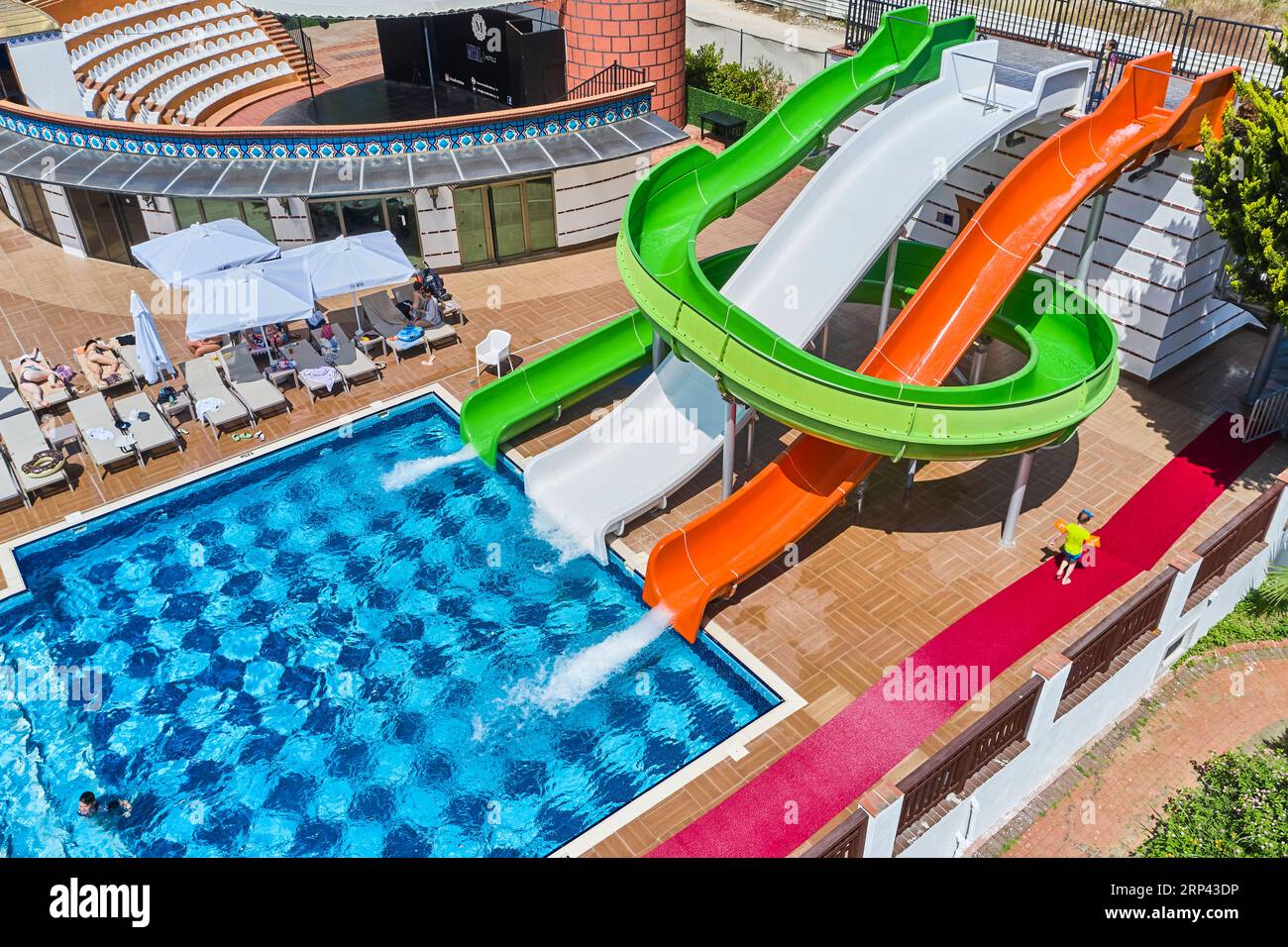 beautiful drone shot of a hotel's pool and water slides. water park of a hotel. playground of a hotel. hotel pool Stock Photo