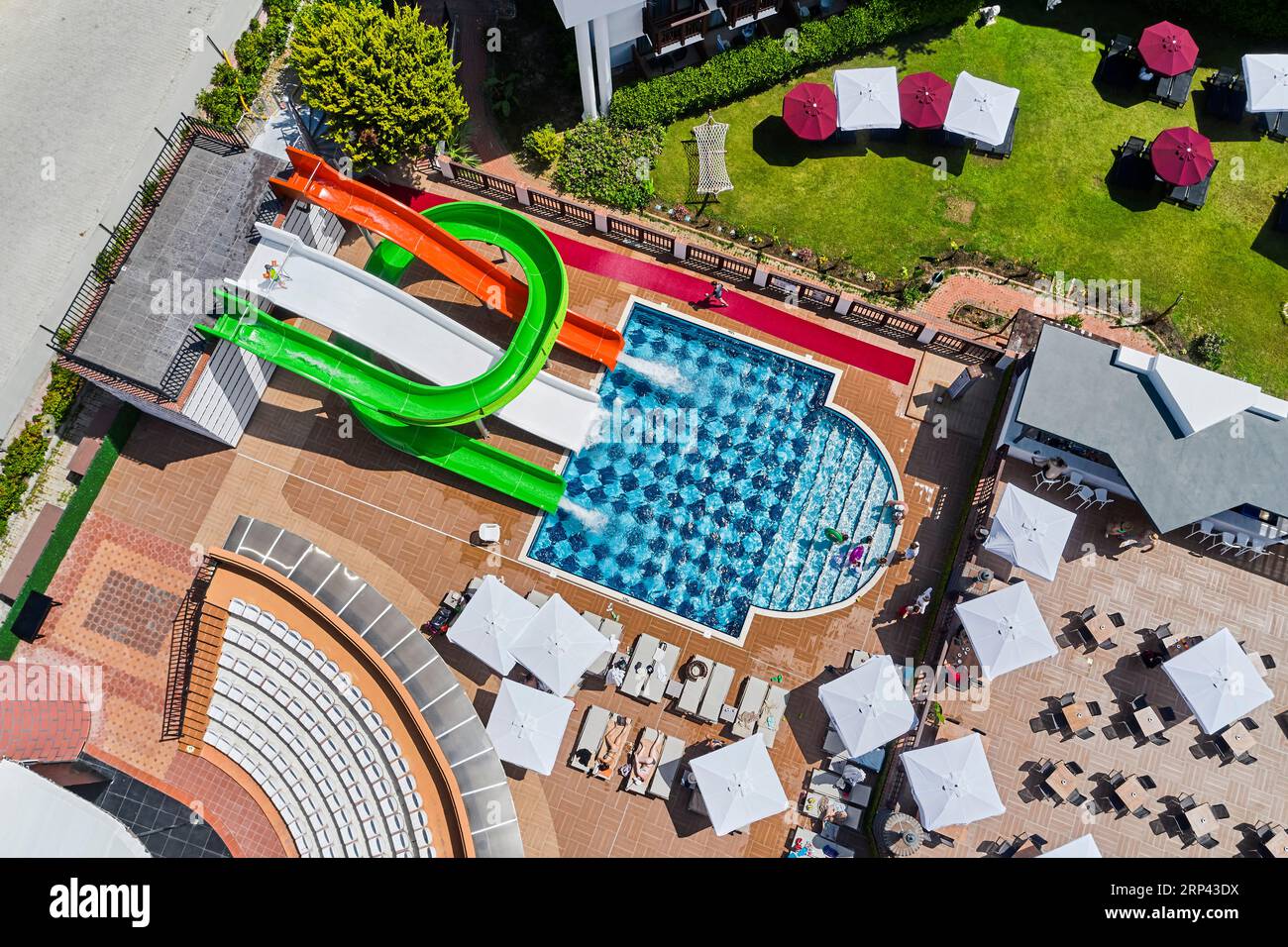 beautiful drone shot of a hotel's pool and water slides. water park of a hotel. playground of a hotel. hotel pool Stock Photo
