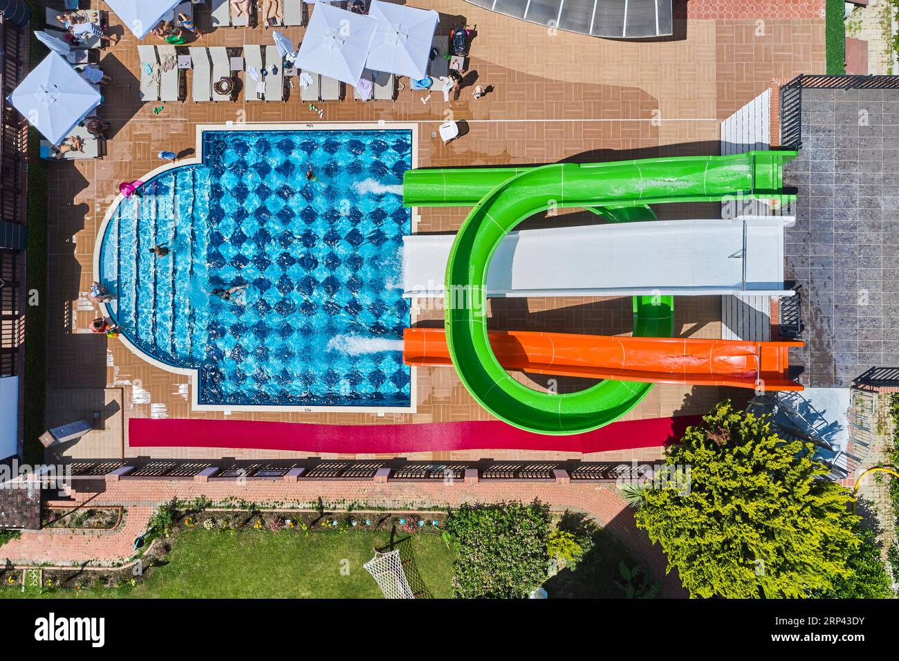 beautiful drone shot of a hotel's pool and water slides. water park of ...