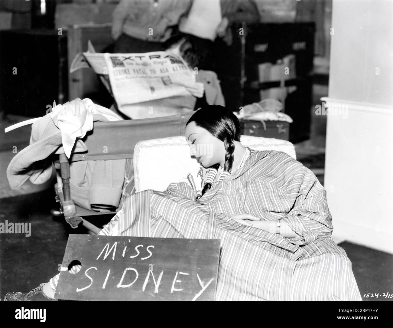 SYLVIA SIDNEY on set candid sleeping during break in filming of BEHOLD MY WIFE ! 1934 director MITCHELL LEISEN novel Gilbert Parker producer B.P. Schulberg Paramount Pictures Stock Photo