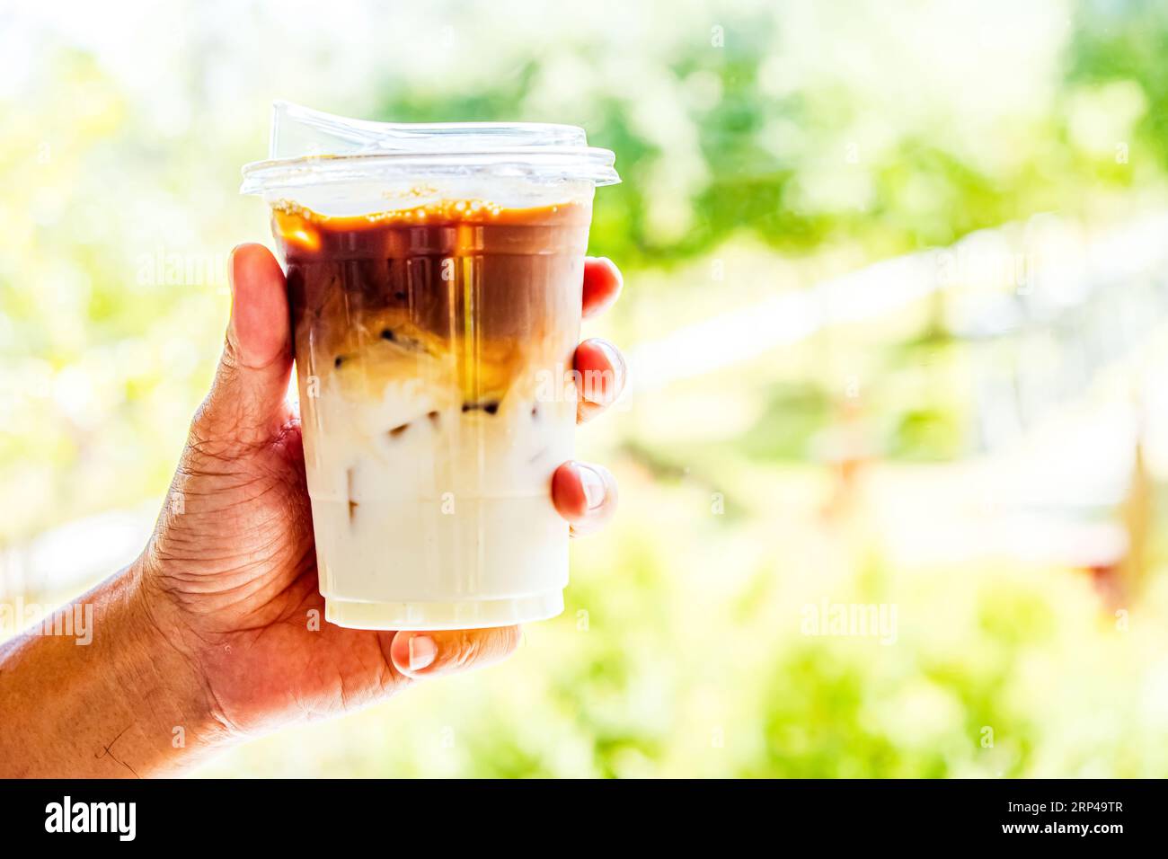 Hand Holding Iced Coffee Stock Photo - Alamy