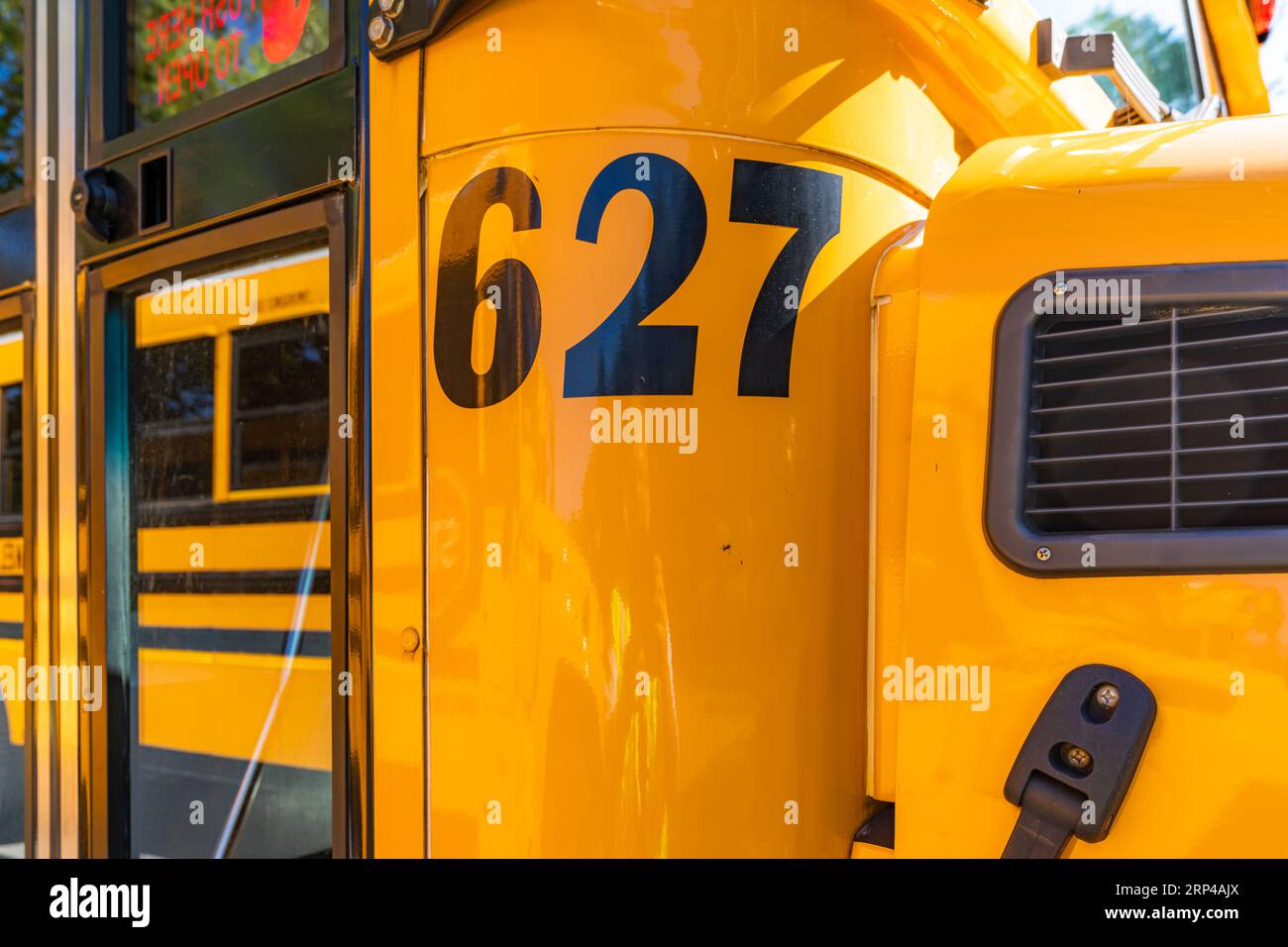 Front of a parked yellow school bus number 627 Stock Photo Alamy