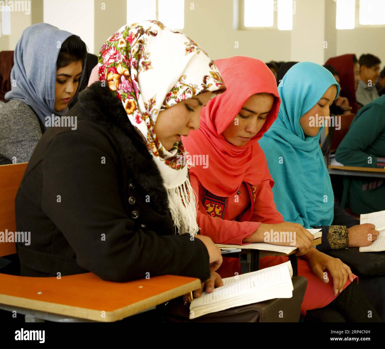 (181104) -- BAMIYAN, Nov. 4, 2018 -- University students attend a class at Bamiyan University in Bamiyan province, central Afghanistan, Nov. 4, 2018. Established around two decades ago, but shut down by the Taliban outfit in 1997, after the armed outfit overran Bamiyan province, Bamiyan University was reopened in 2003 and since then has been serving as the main higher educational center in the highland region of Afghanistan. TO GO WITH Feature: More girls enroll in university in Afghanistan s Bamiyan province, post-grad job situation remains tight )(psw) AFGHANISTAN-BAMIYAN-GIRLS-EDUCATION Noo Stock Photo