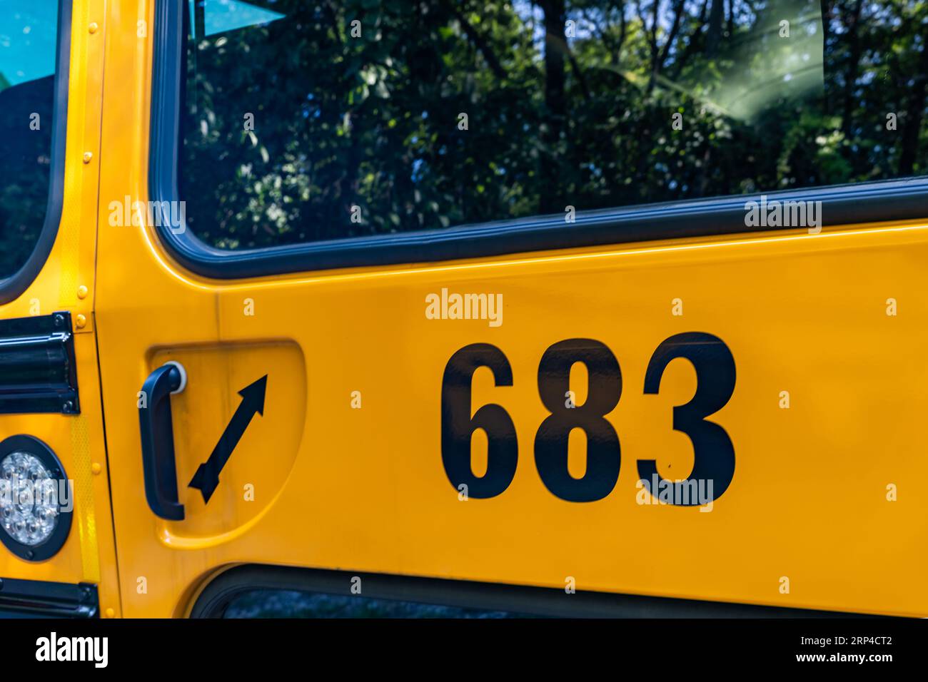 Rear of a parked yellow school bus number 683 Stock Photo Alamy