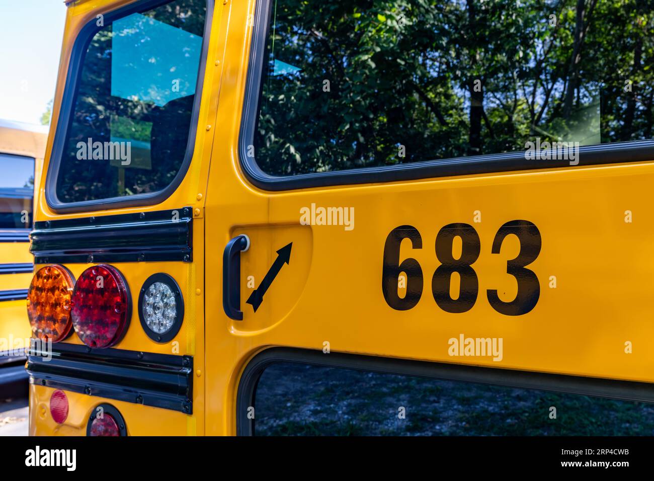 Rear of a parked yellow school bus number 683 Stock Photo Alamy