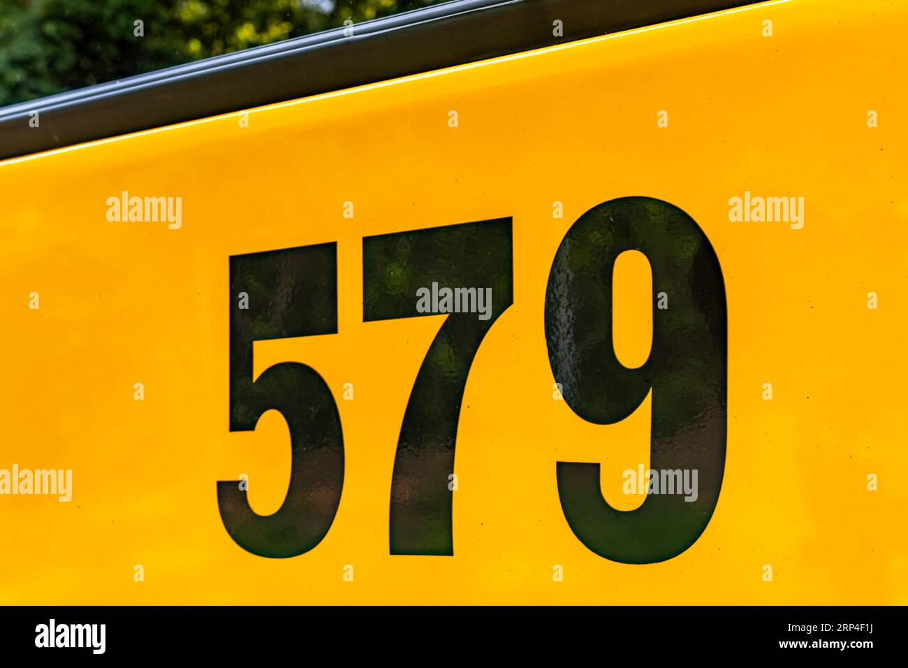Back of a parked yellow school bus number 579 Stock Photo Alamy