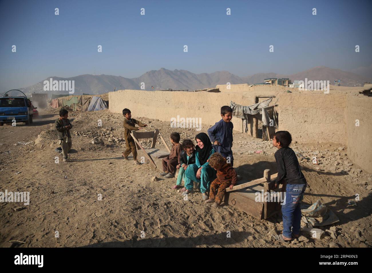 (181120) -- KABUL, Nov. 20, 2018 -- Afghan children play outside their mud houses on World Children s Day in Kabul, capital of Afghanistan, Nov. 20, 2018. The United Nations Children s Fund (UNICEF) office in Afghanistan said on Monday that about 3.7 million Afghan children have no access to school due to insecurity and poverty in the country. ) AFGHANISTAN-KABUL-WORLD CHILDREN DAY RahmatxAlizadah PUBLICATIONxNOTxINxCHN Stock Photo