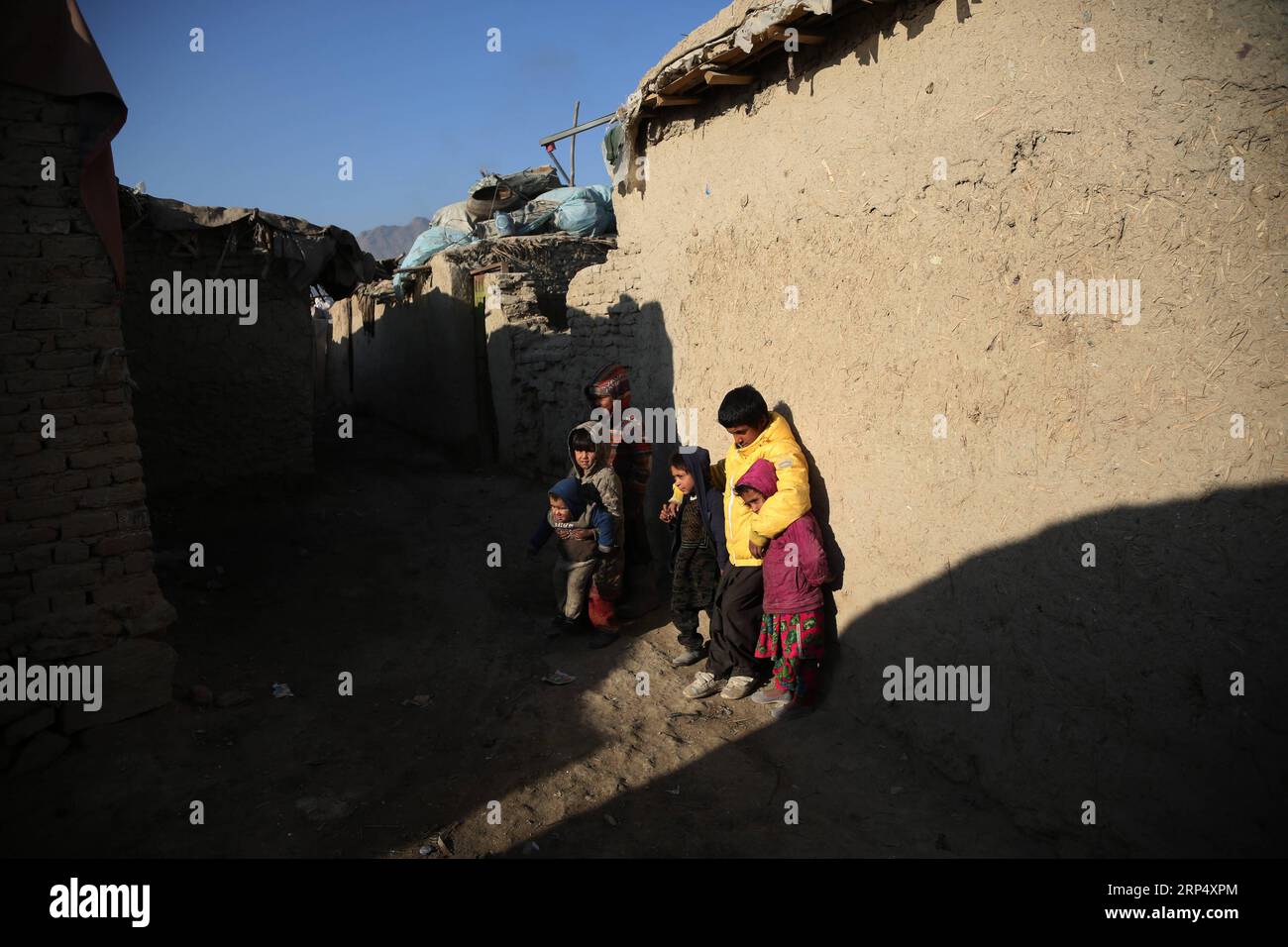 (181120) -- KABUL, Nov. 20, 2018 -- Afghan children stand outside their mud houses on World Children s Day in Kabul, capital of Afghanistan, Nov. 20, 2018. The United Nations Children s Fund (UNICEF) office in Afghanistan said on Monday that about 3.7 million Afghan children have no access to school due to insecurity and poverty in the country. ) AFGHANISTAN-KABUL-WORLD CHILDREN DAY RahmatxAlizadah PUBLICATIONxNOTxINxCHN Stock Photo