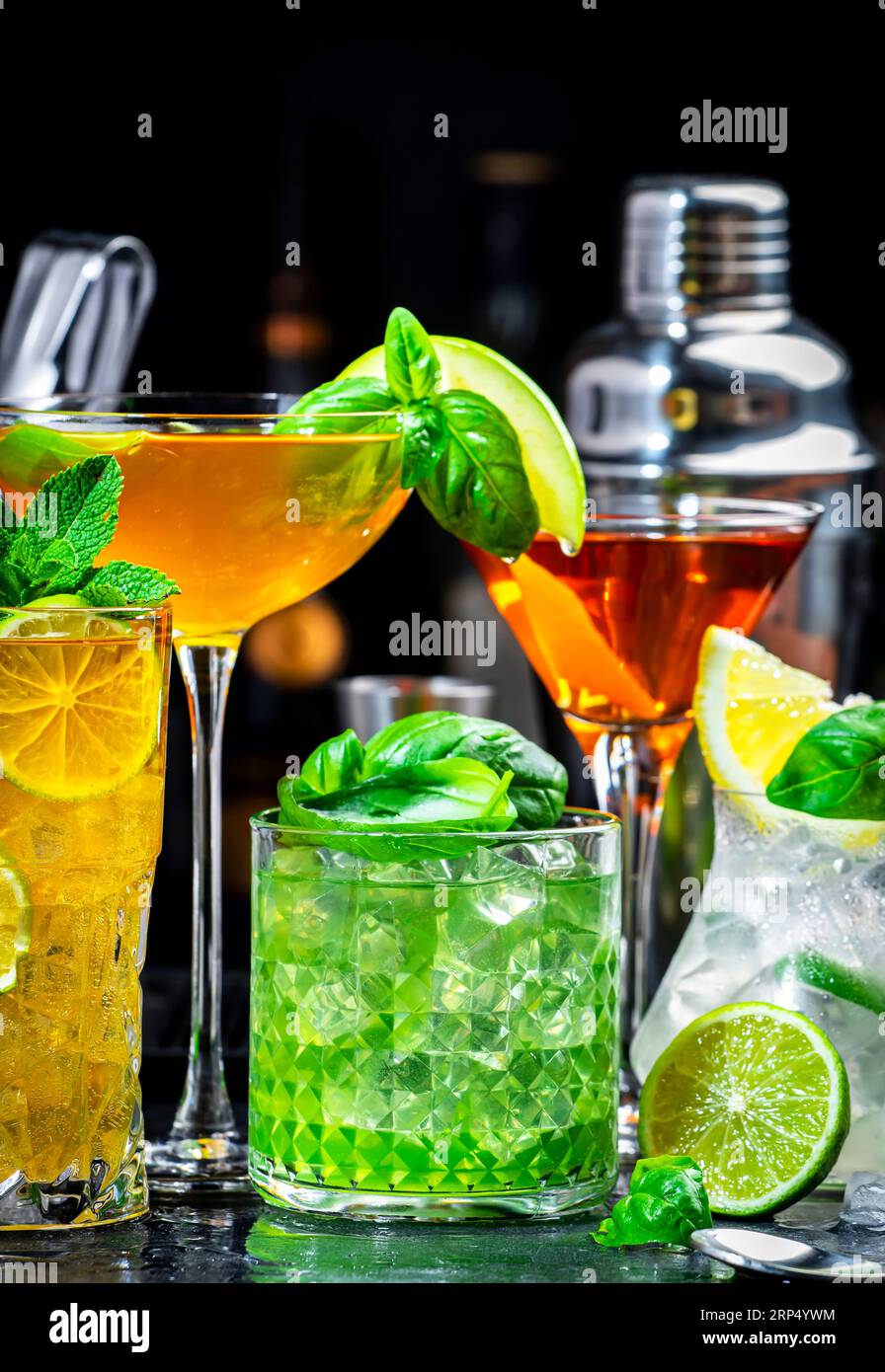Alcoholic cocktail drinks with gin, whiskey, vermouth and liquor, black