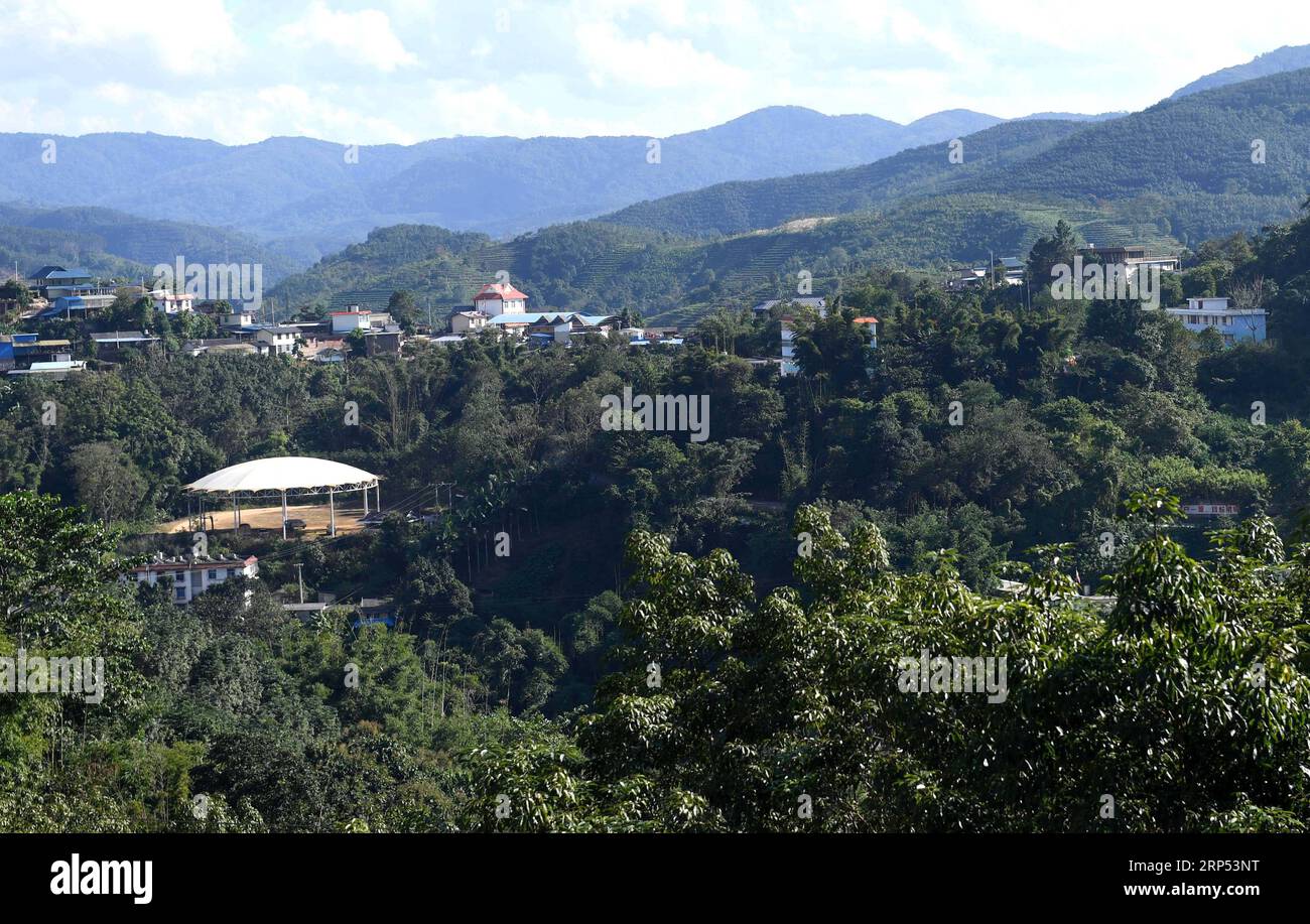 (181126) -- KUNMING, Nov. 26, 2018 -- Aerial photo taken on Nov. 20, 2018 shows a view of the Jino Ethnic Township on Jino Mountain in Jinghong of Xishuangbanna Dai Autonomous Prefecture, southwest China s Yunnan Province. With a population of slightly over 20,000, the Jino people had only been officially acknowledged in 1979 as an independent ethnic group of China. Until 1949, most of them had lived for generations in primitive mountain tribes in southwest China s Yunnan Province. Over the four decades since it embraced the reform and opening-up policy, China has spared no effort to support e Stock Photo