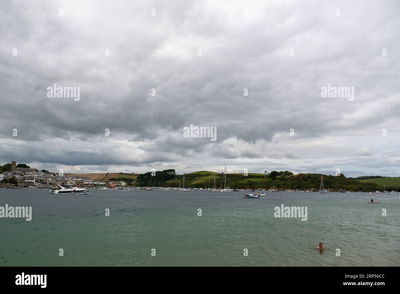 Panorama of Salcombe taken from the Ferry jetty on East Portlemouth, stormy cloud dominating the sky with boats at anchor in front of Snapes Point. Stock Photo