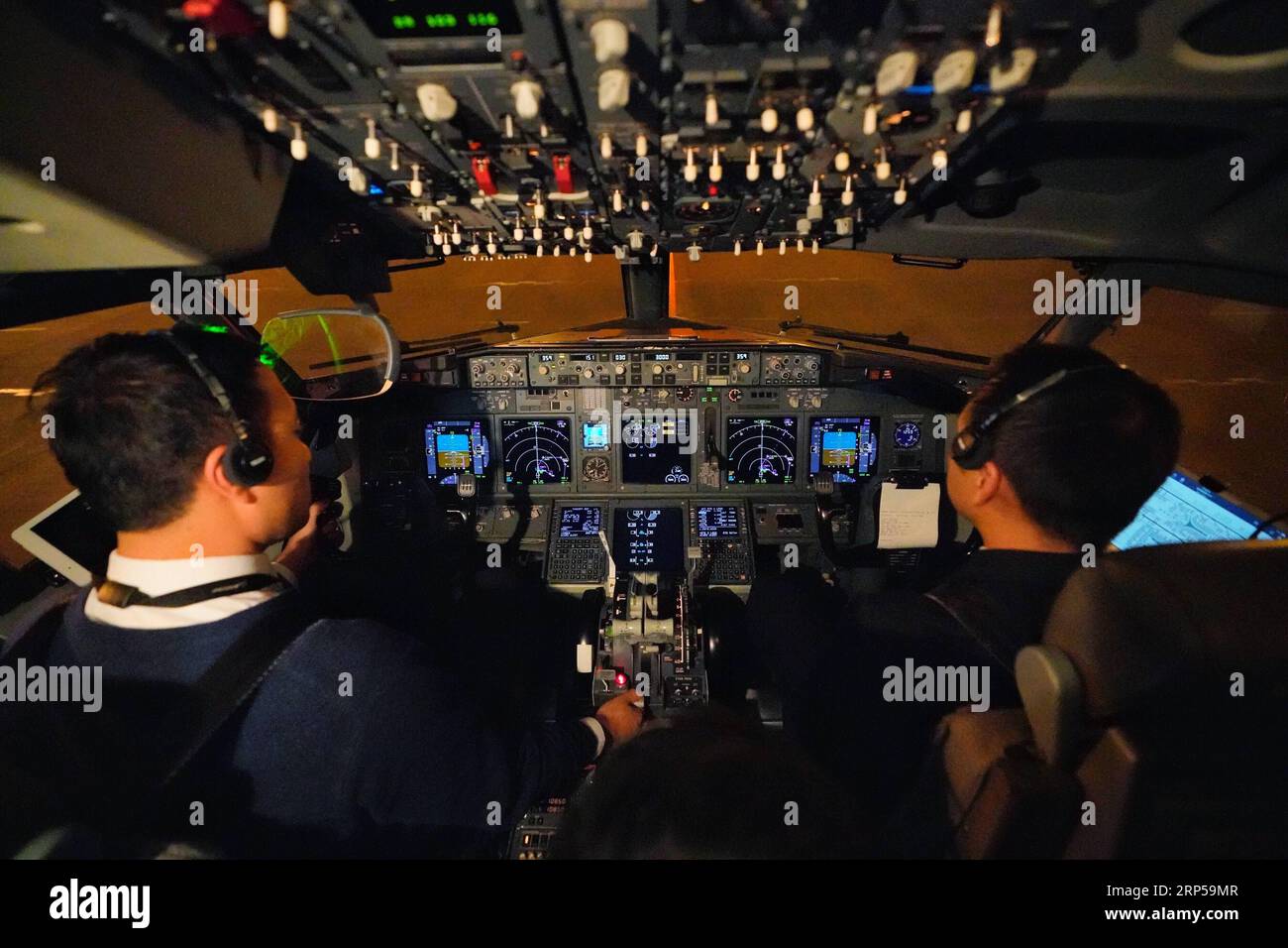181205) -- BEIJING, Dec. 5, 2018 -- Gao Yujie (L) and Yuan Biao, captains  of the Shandong Airlines, prepare for a verification takeoff of a Boeing  B738 at Capital International Airport in