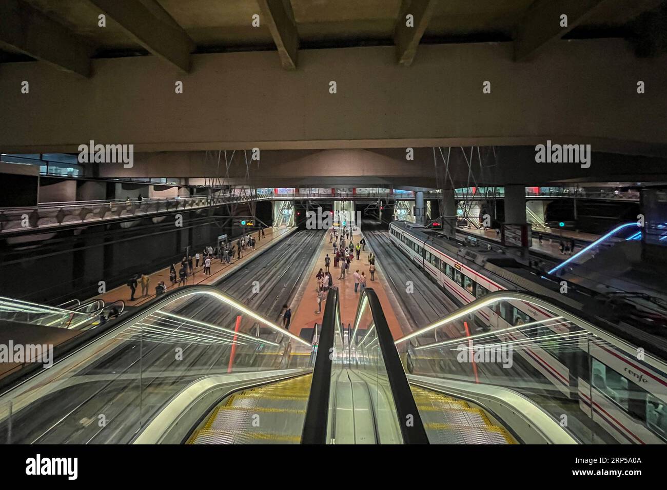 People walk through the corridors of the Sol suburban station in Madrid