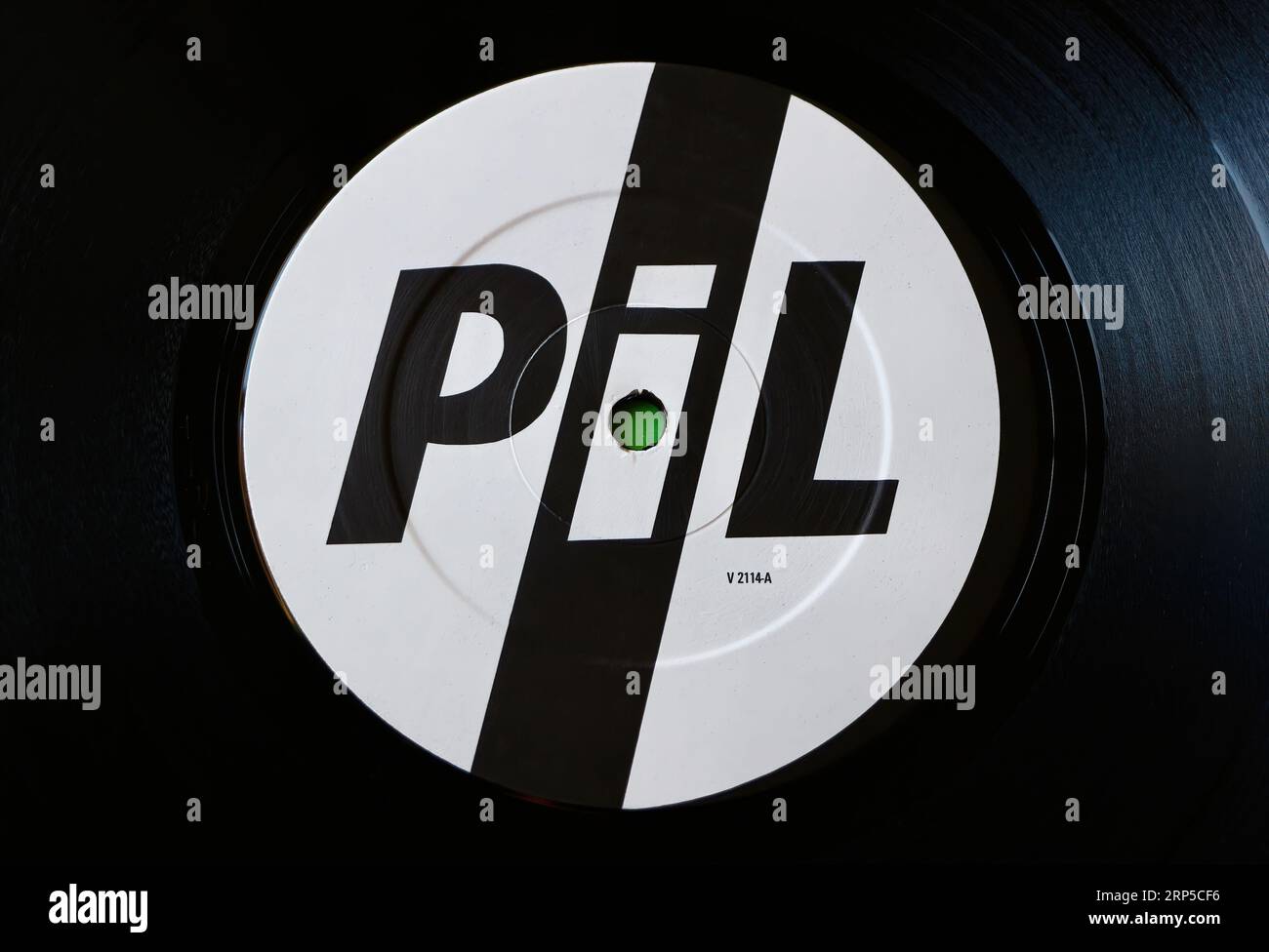 Photo close up of a centre label on an original 1984 pressing of a long playing vinyl disc Commercial Zone By Public Image Limited PiL Stock Photo