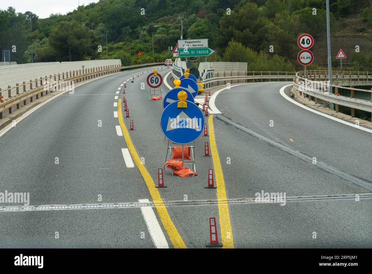 Road signs and markings indicating the direction of movement and the ...