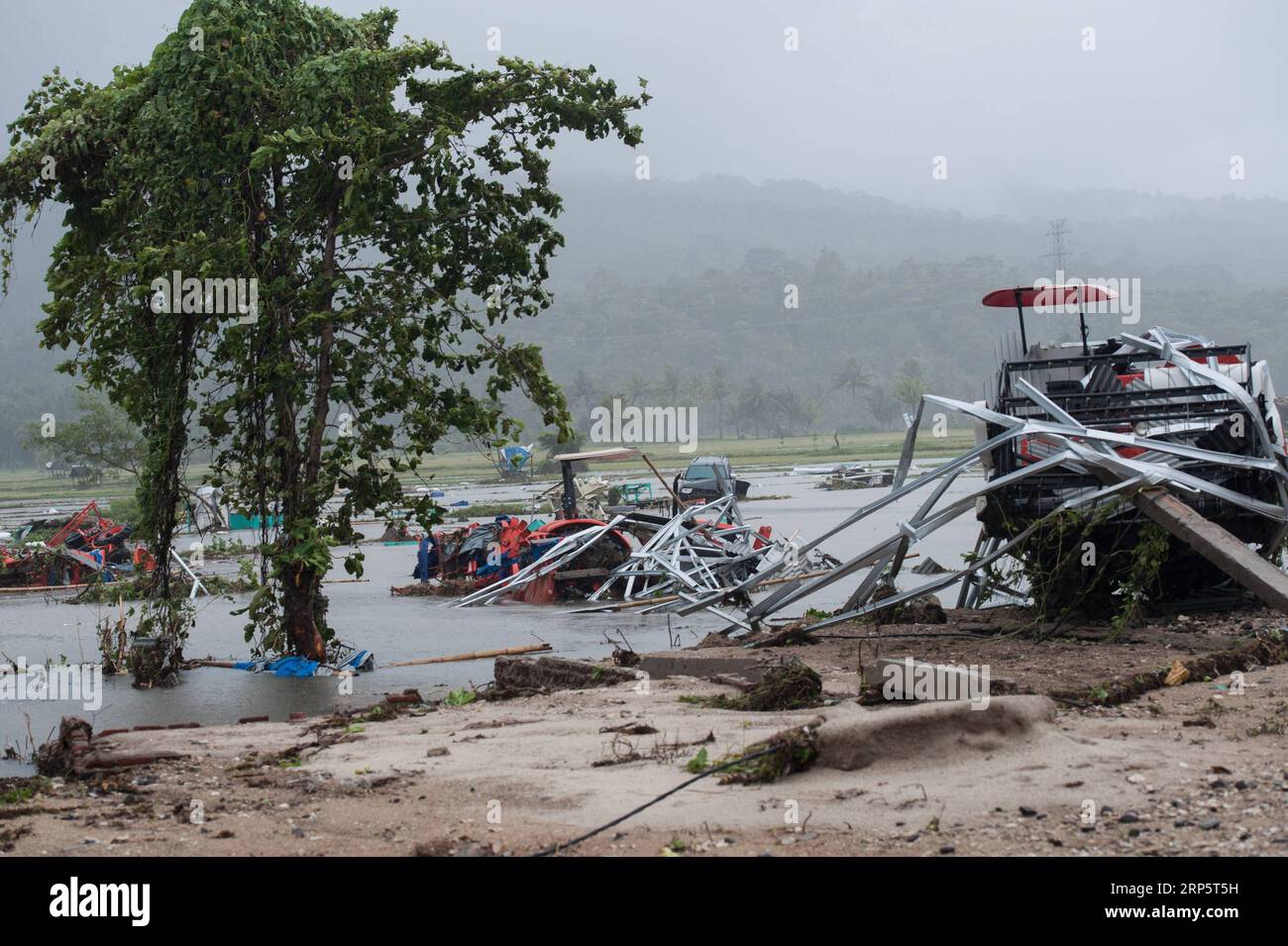 (181223) -- PANDEGLANG, Dec. 23, 2018 -- Cars and tractors are seen among the debris after a tsunami hit Sunda Strait in Pandeglang, Banten province, in Indonesia, Dec. 23, 2018. The total casualty of a tsunami triggered by the eruption of Krakatau Child volcano has increased to 168 people in coastal areas of Sunda Strait of western Indonesia, disaster agency official said here on Sunday. The catastrophe killed at least 168 people, wounded at least 745 ones and collapsed a total of 430 houses and nine hotels, and caused damages to scores of ships. ) INDONESIA-PANDEGLANG-TSUNAMI-AFTERMATH Verix Stock Photo