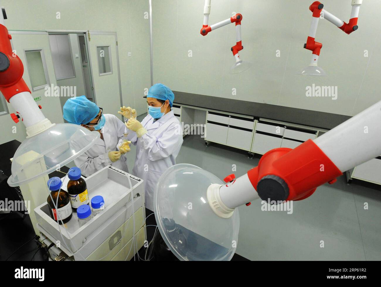 (181230) -- BEIJING, Dec. 30, 2018 (Xinhua) -- Technicians detect a non-alcohol drink made of bamboo in a biotechnology company in Anji County, east China s Zhejiang Province, June 3, 2016. Anji is known for its pleasant environment with flourishing bamboo plantations and many scenes from the famous movie Crouching Tiger, Hidden Dragon were shot here. The county persists in green, low-carbon development, and strives to protect environment as well as to develop local economy. China has pledged to coordinate its efforts of environmental protection and economic development in 2019, an important y Stock Photo
