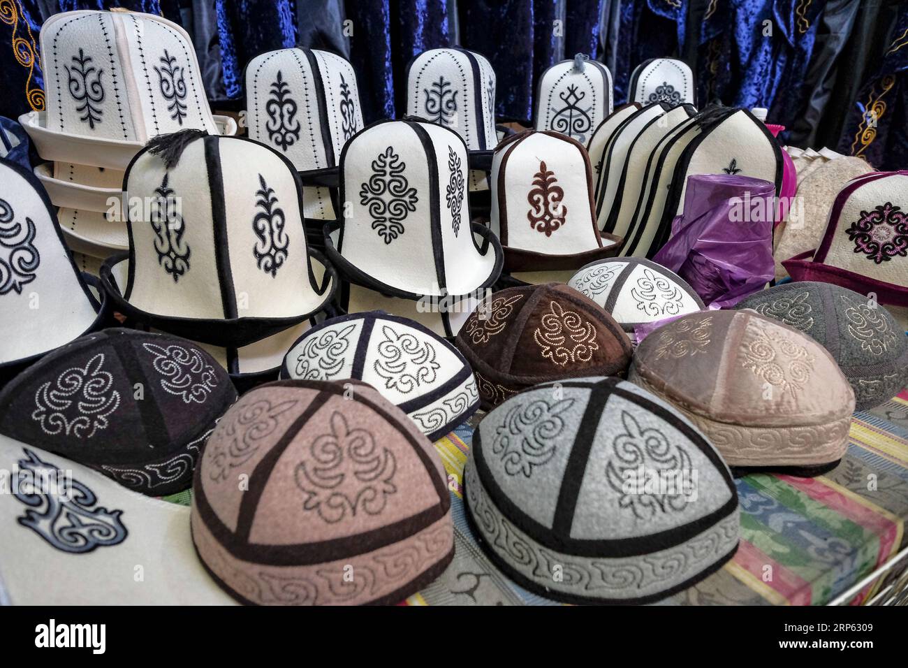 Stall selling traditional clothing in the Osh Bazaar in Bishkek ...